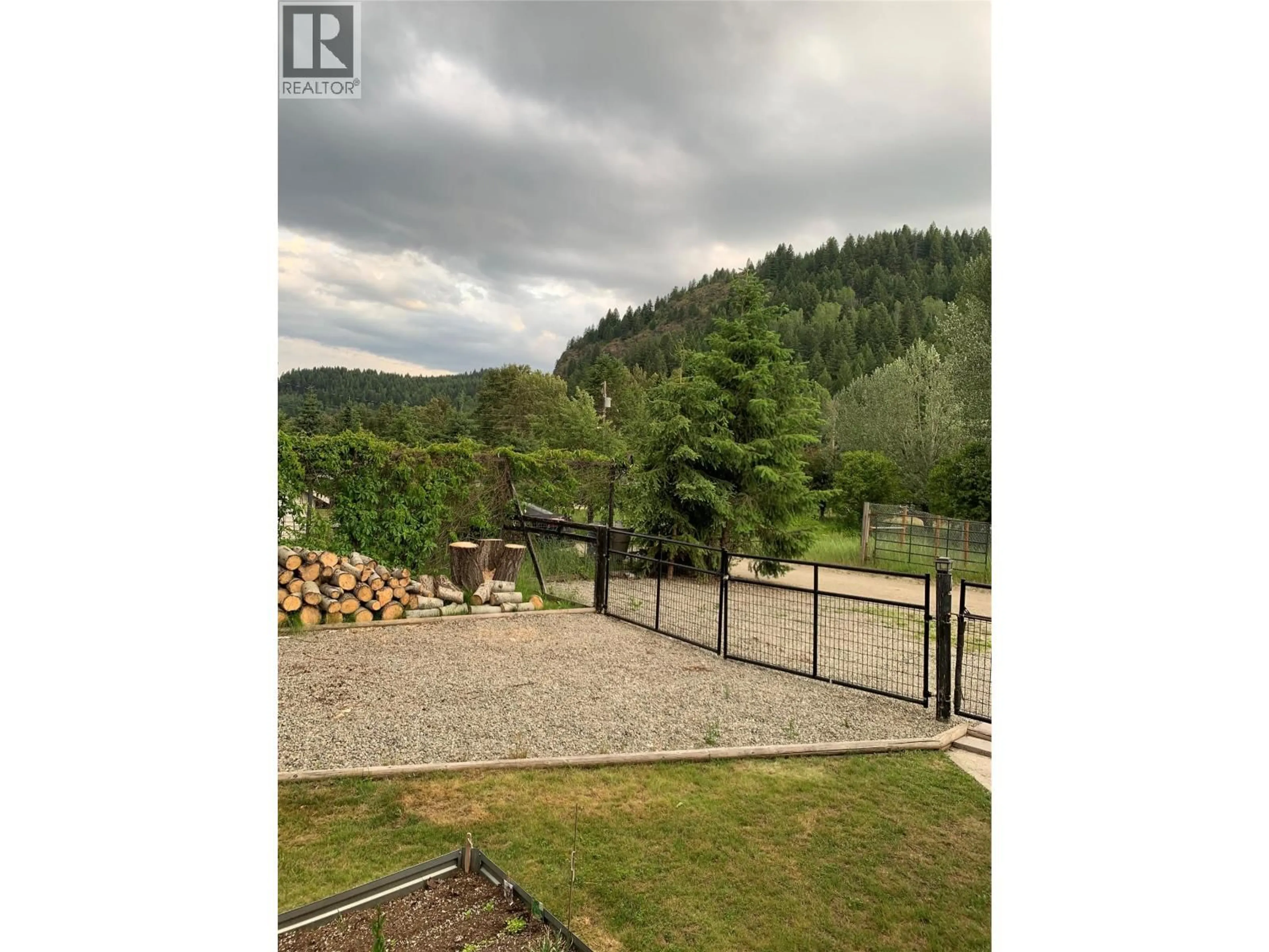 A pic from outside/outdoor area/front of a property/back of a property/a pic from drone, forest/trees view for 570 NICKEL LANE, Greenwood British Columbia V0H1J0