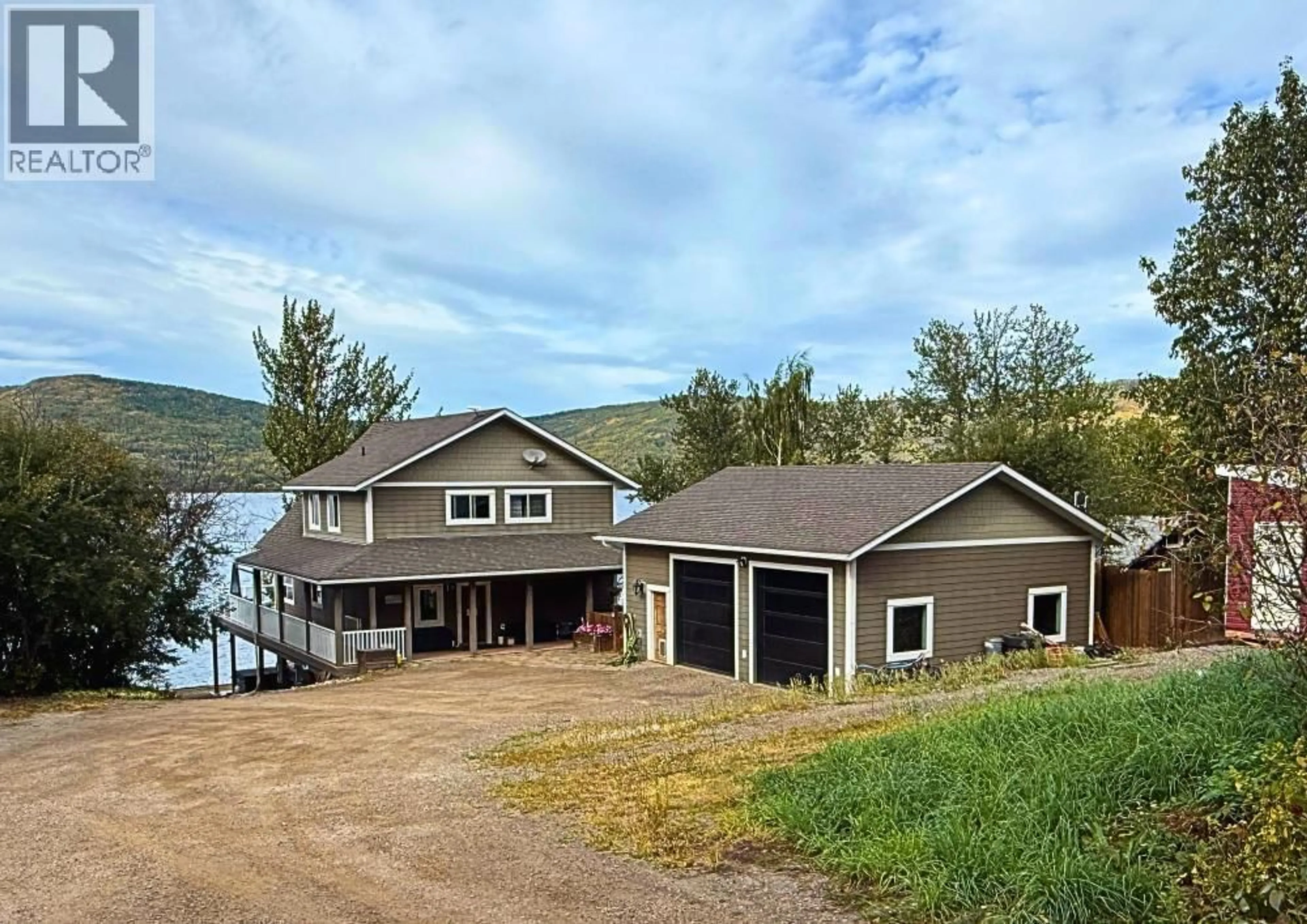 A pic from outside/outdoor area/front of a property/back of a property/a pic from drone, water/lake/river/ocean view for 6986 SOUTH MOBERLY LAKE ROAD, Moberly Lake British Columbia V0C1X0