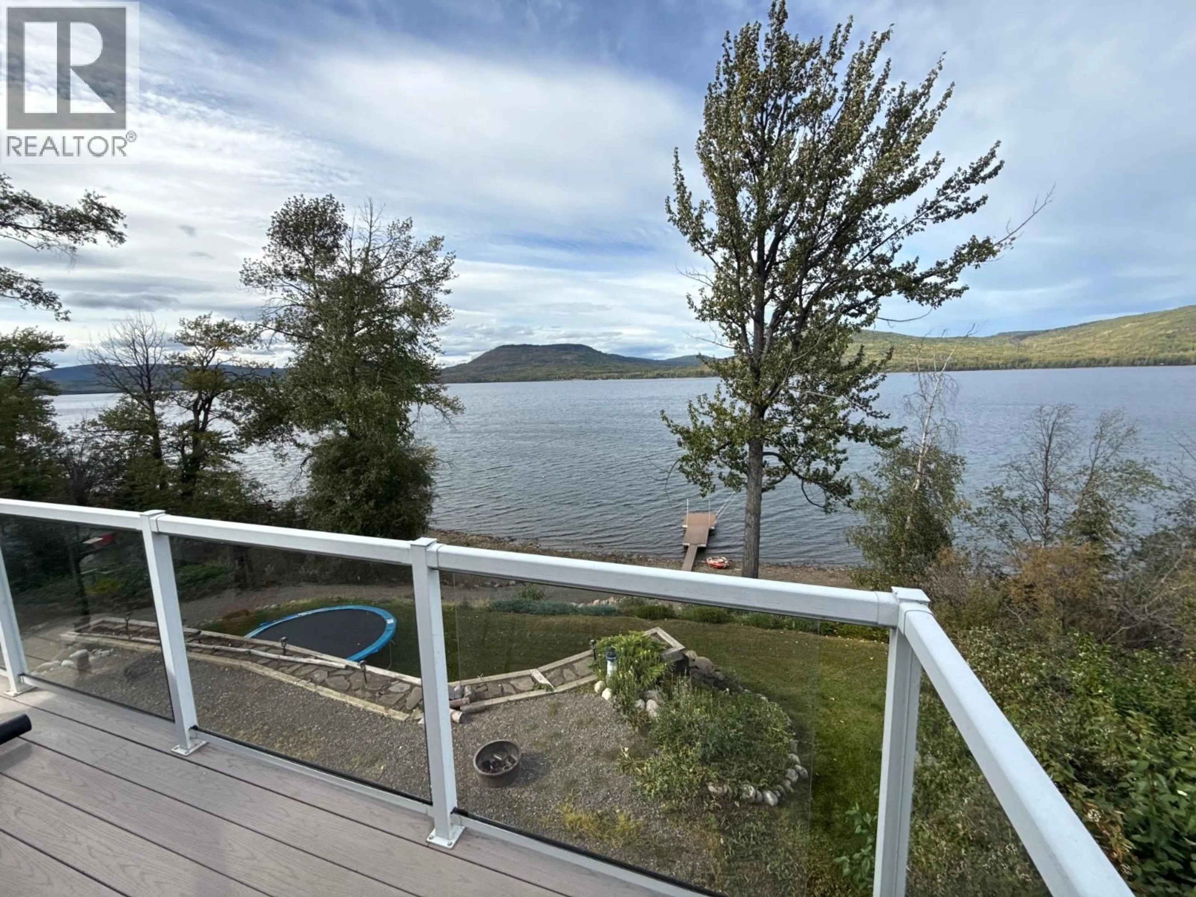 A pic from outside/outdoor area/front of a property/back of a property/a pic from drone, water/lake/river/ocean view for 6986 SOUTH MOBERLY LAKE ROAD, Moberly Lake British Columbia V0C1X0