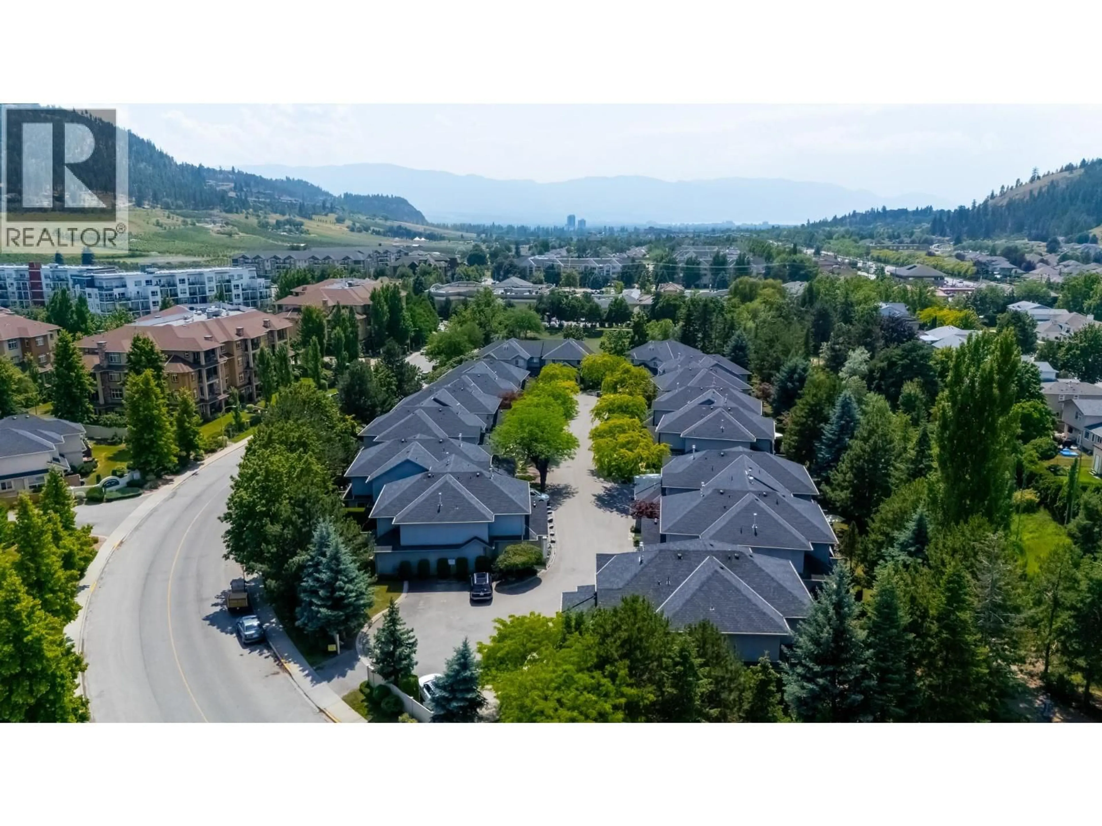 A pic from outside/outdoor area/front of a property/back of a property/a pic from drone, mountain view for 4 - 316 WHITMAN ROAD, Kelowna British Columbia V1V1Y9