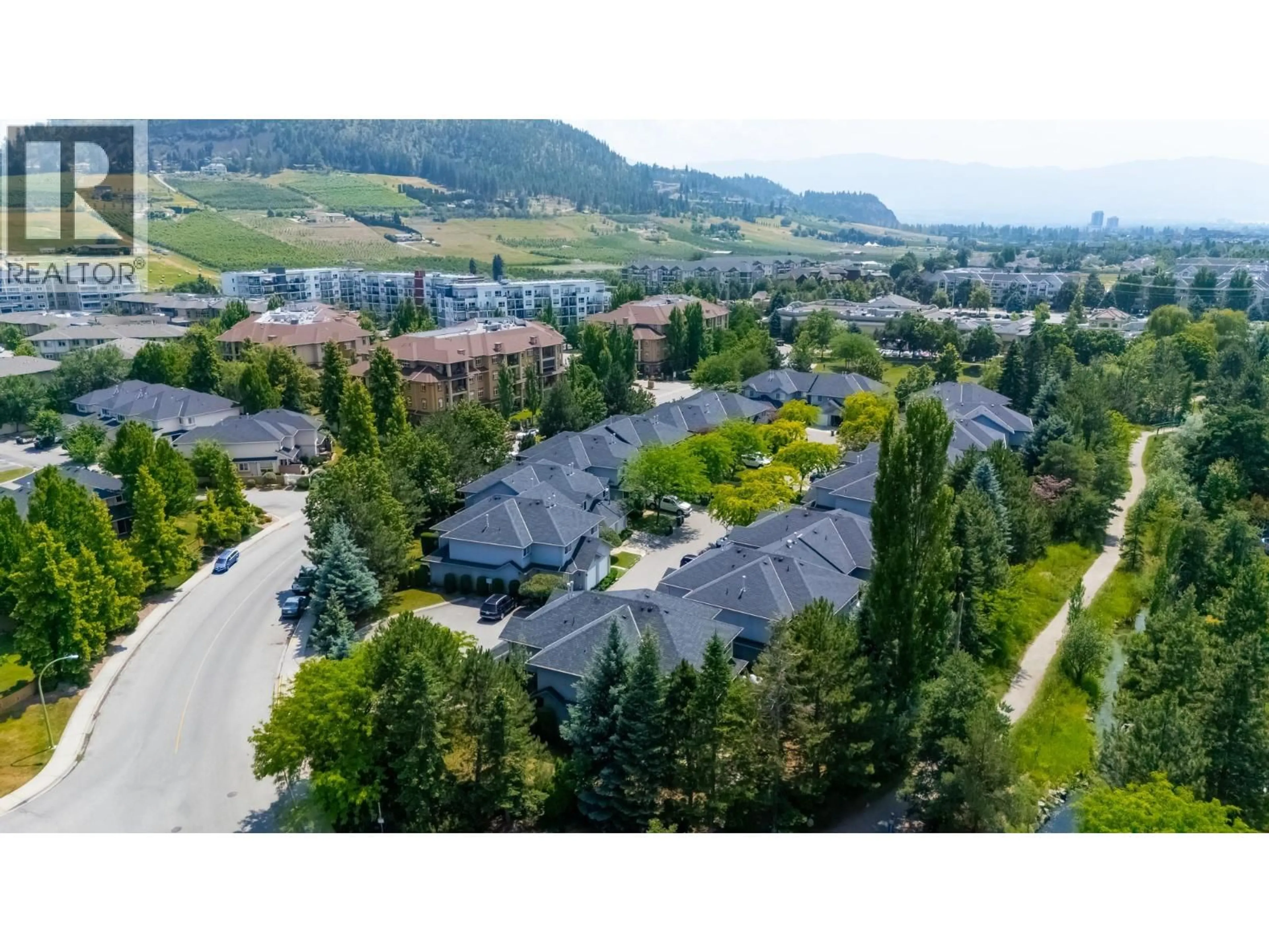 A pic from outside/outdoor area/front of a property/back of a property/a pic from drone, mountain view for 4 - 316 WHITMAN ROAD, Kelowna British Columbia V1V1Y9