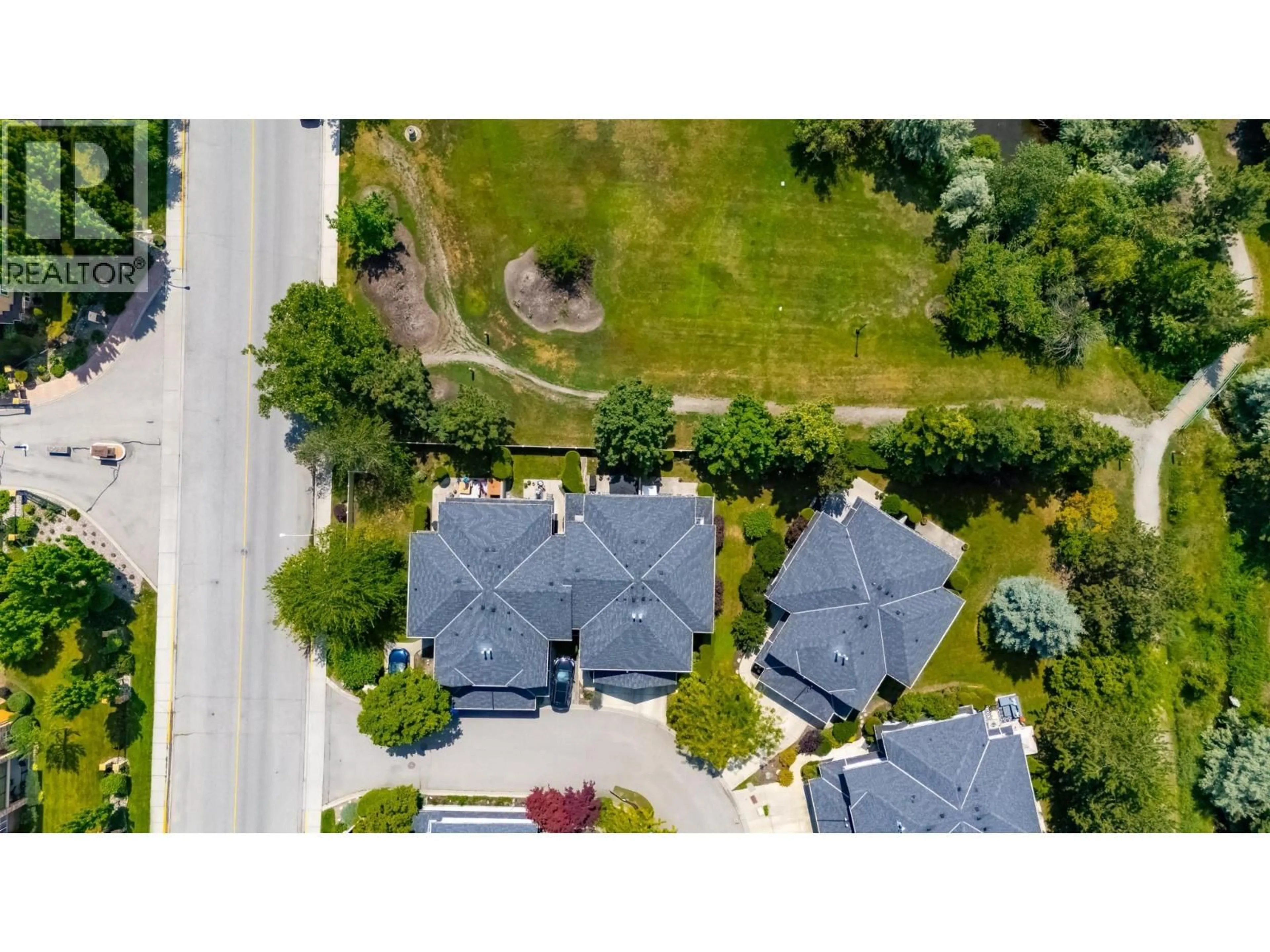 A pic from outside/outdoor area/front of a property/back of a property/a pic from drone, street for 4 - 316 WHITMAN ROAD, Kelowna British Columbia V1V1Y9