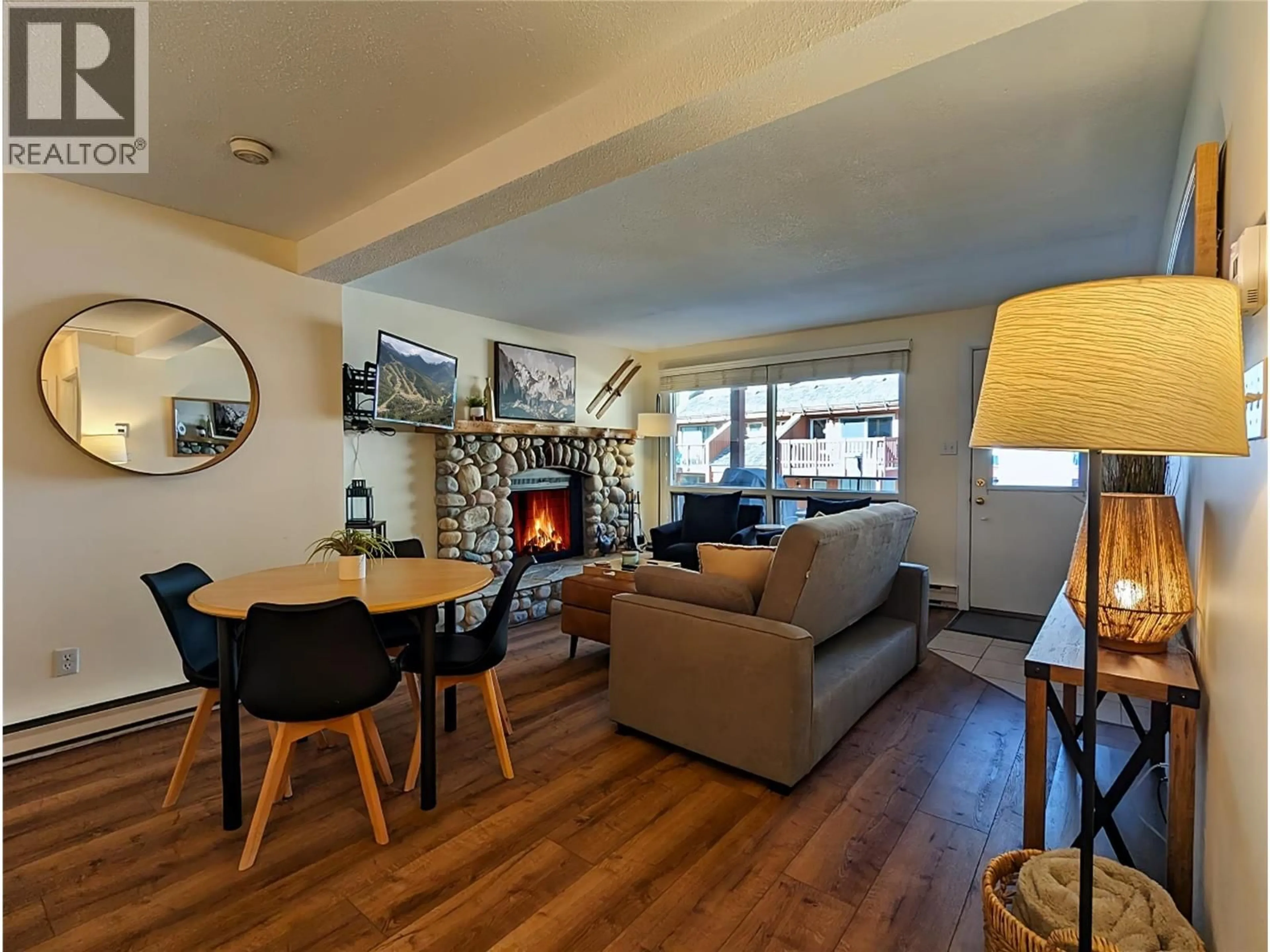 Living room with furniture, wood/laminate floor for 806 - 2030 PANORAMA DRIVE, Panorama Mountain British Columbia V0A1T0