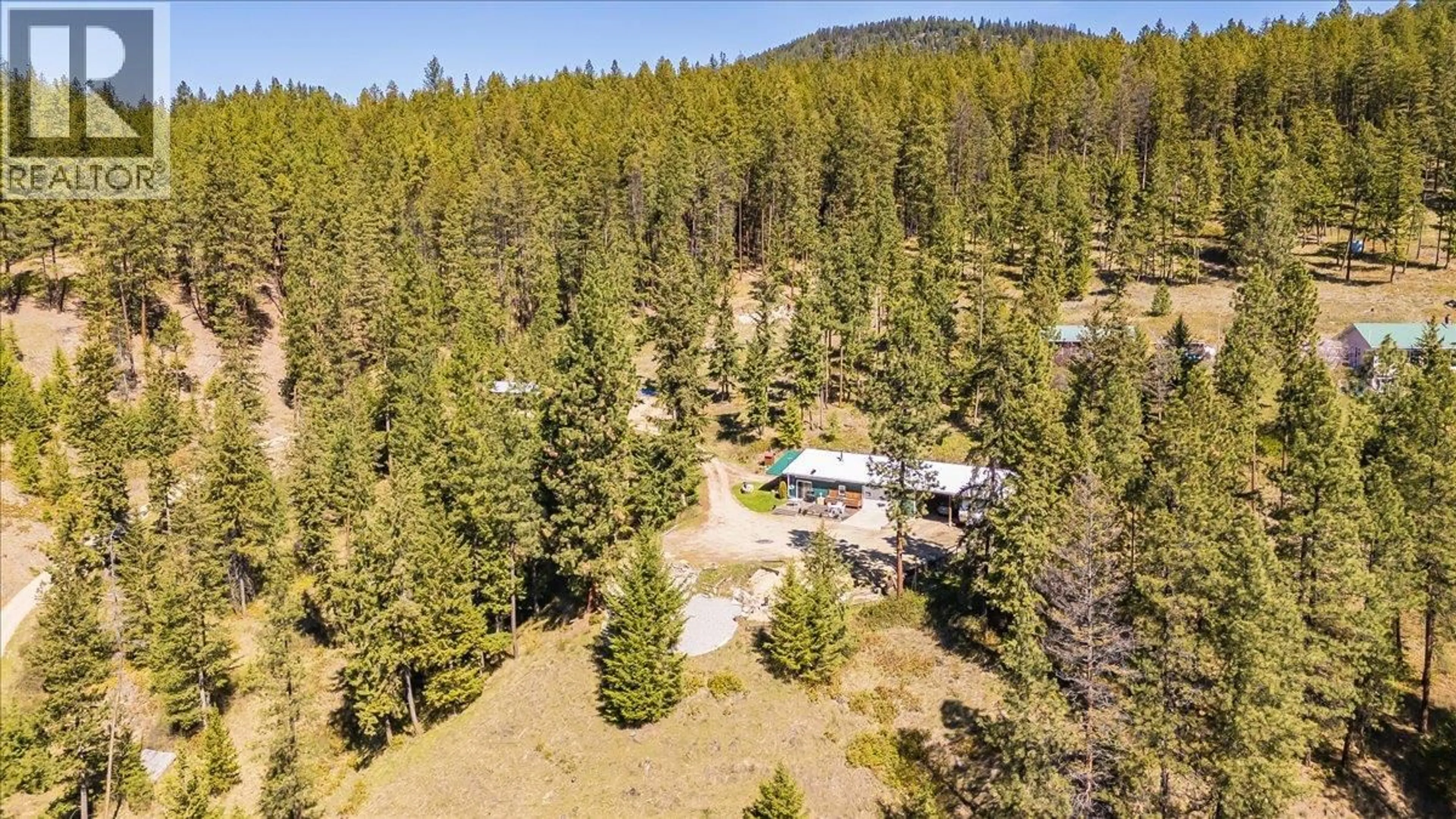 A pic from outside/outdoor area/front of a property/back of a property/a pic from drone, forest/trees view for 7465 BROADWATER ROAD, Castlegar British Columbia V1N4V8