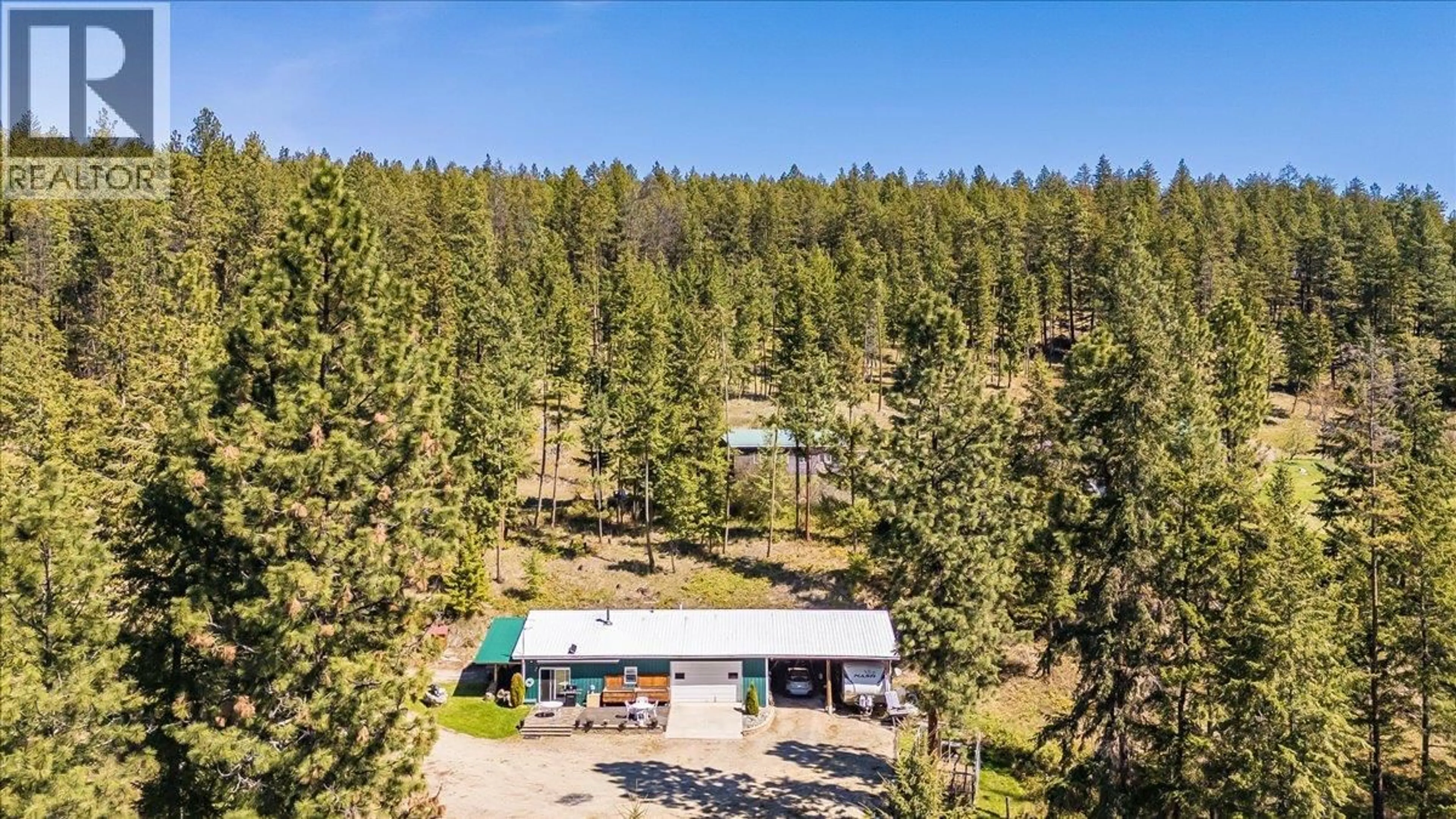 A pic from outside/outdoor area/front of a property/back of a property/a pic from drone, forest/trees view for 7465 BROADWATER ROAD, Castlegar British Columbia V1N4V8