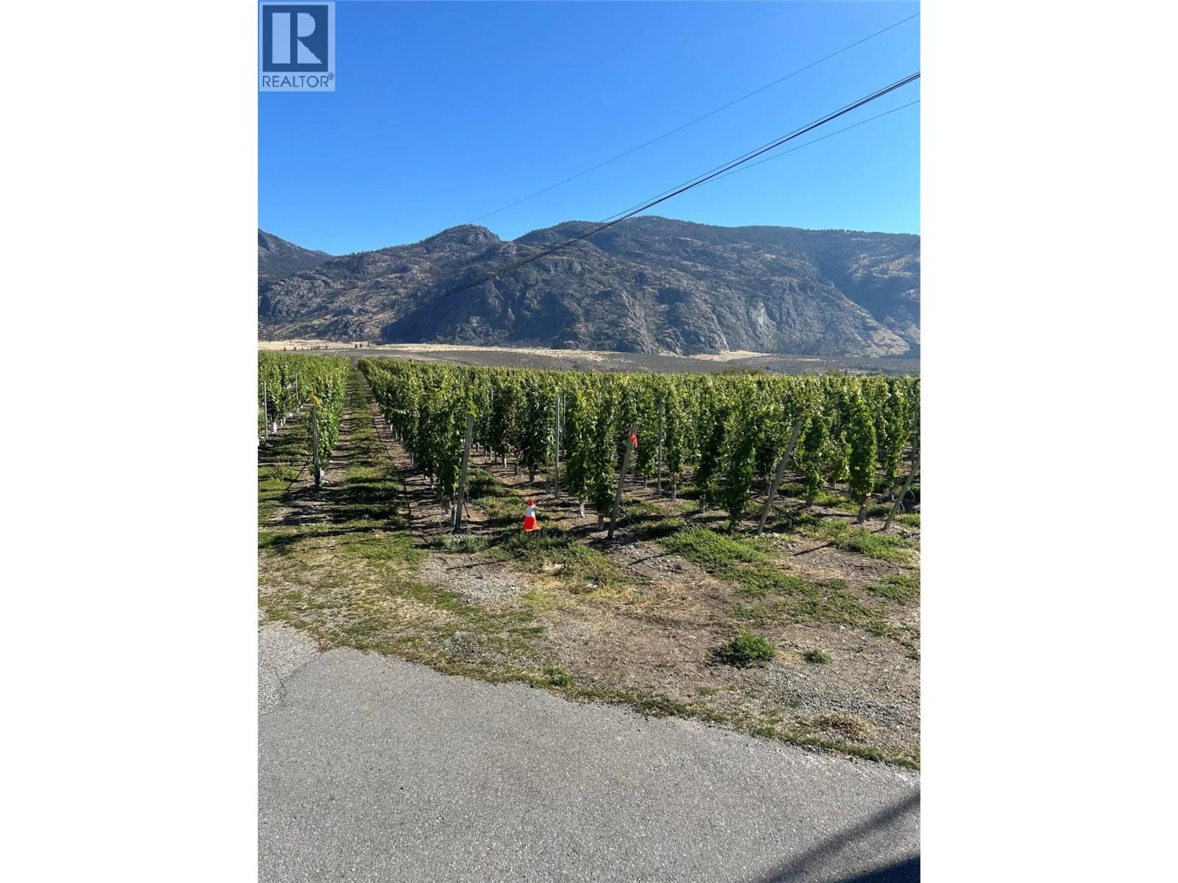 A pic from outside/outdoor area/front of a property/back of a property/a pic from drone, mountain view for 9425 87TH STREET, Osoyoos British Columbia V0H1V0