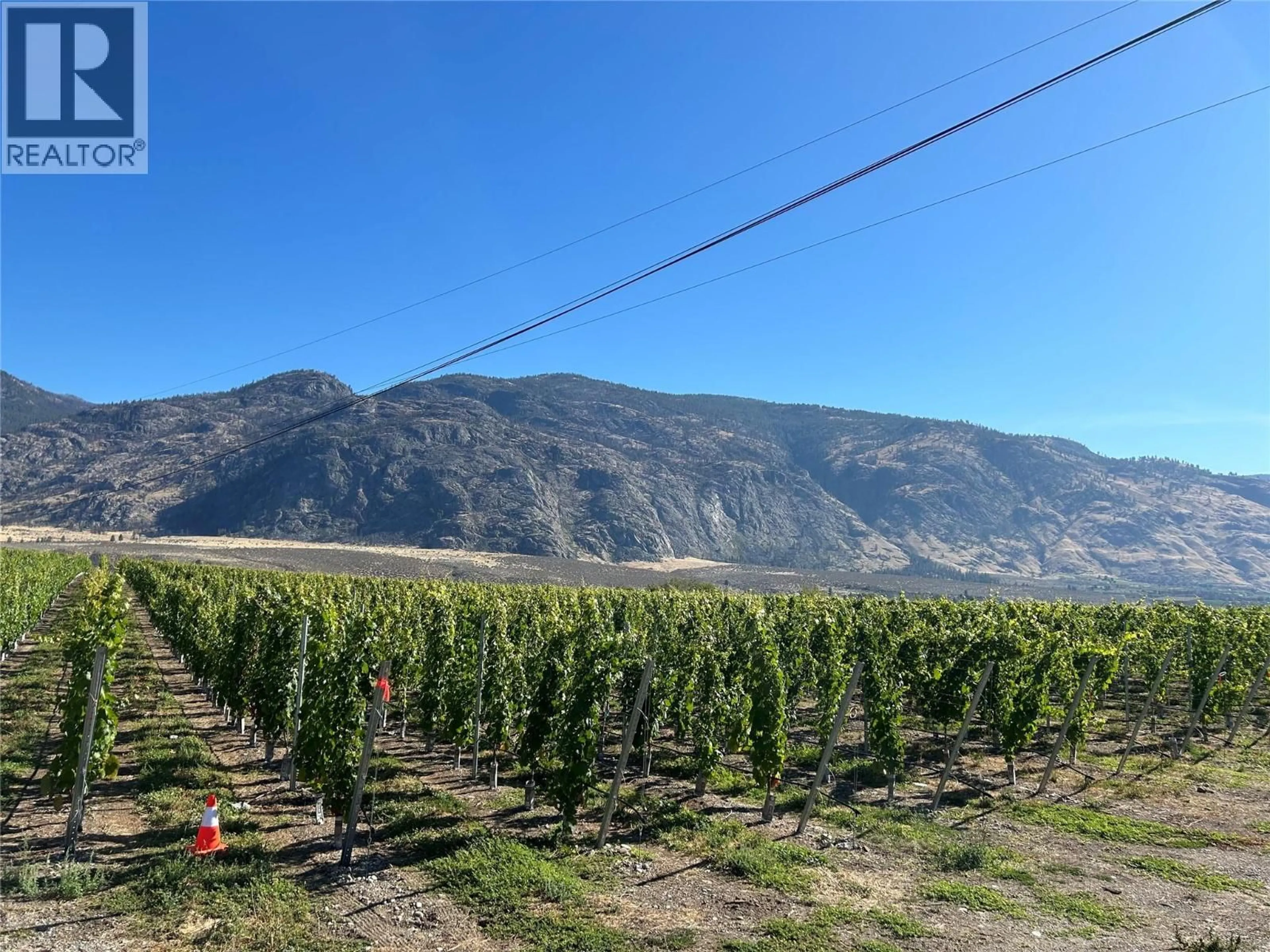 A pic from outside/outdoor area/front of a property/back of a property/a pic from drone, mountain view for 9425 87TH STREET, Osoyoos British Columbia V0H1V0