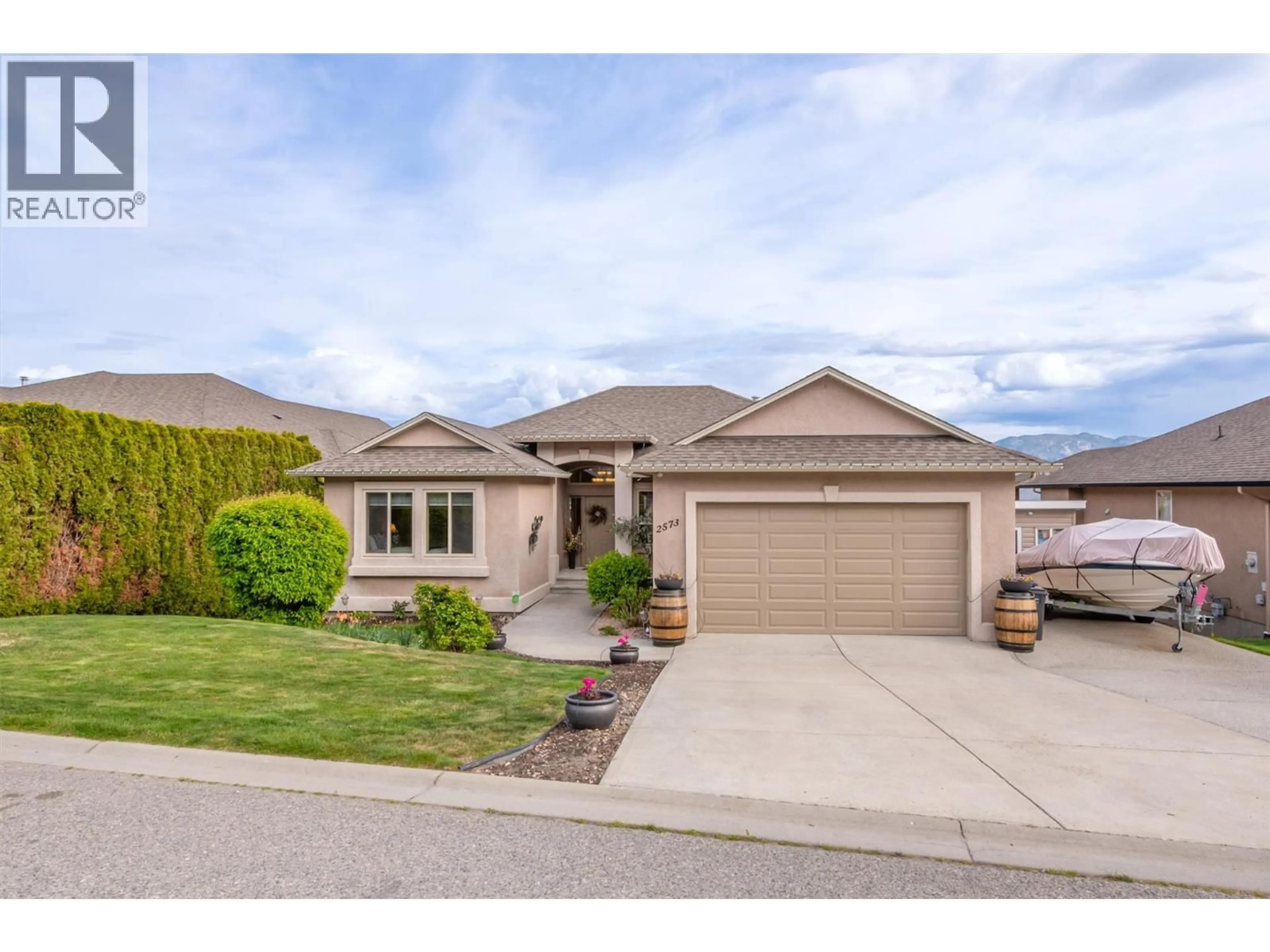 Home with vinyl exterior material, street for 2573 COPPER RIDGE DRIVE, West Kelowna British Columbia V4T2X6