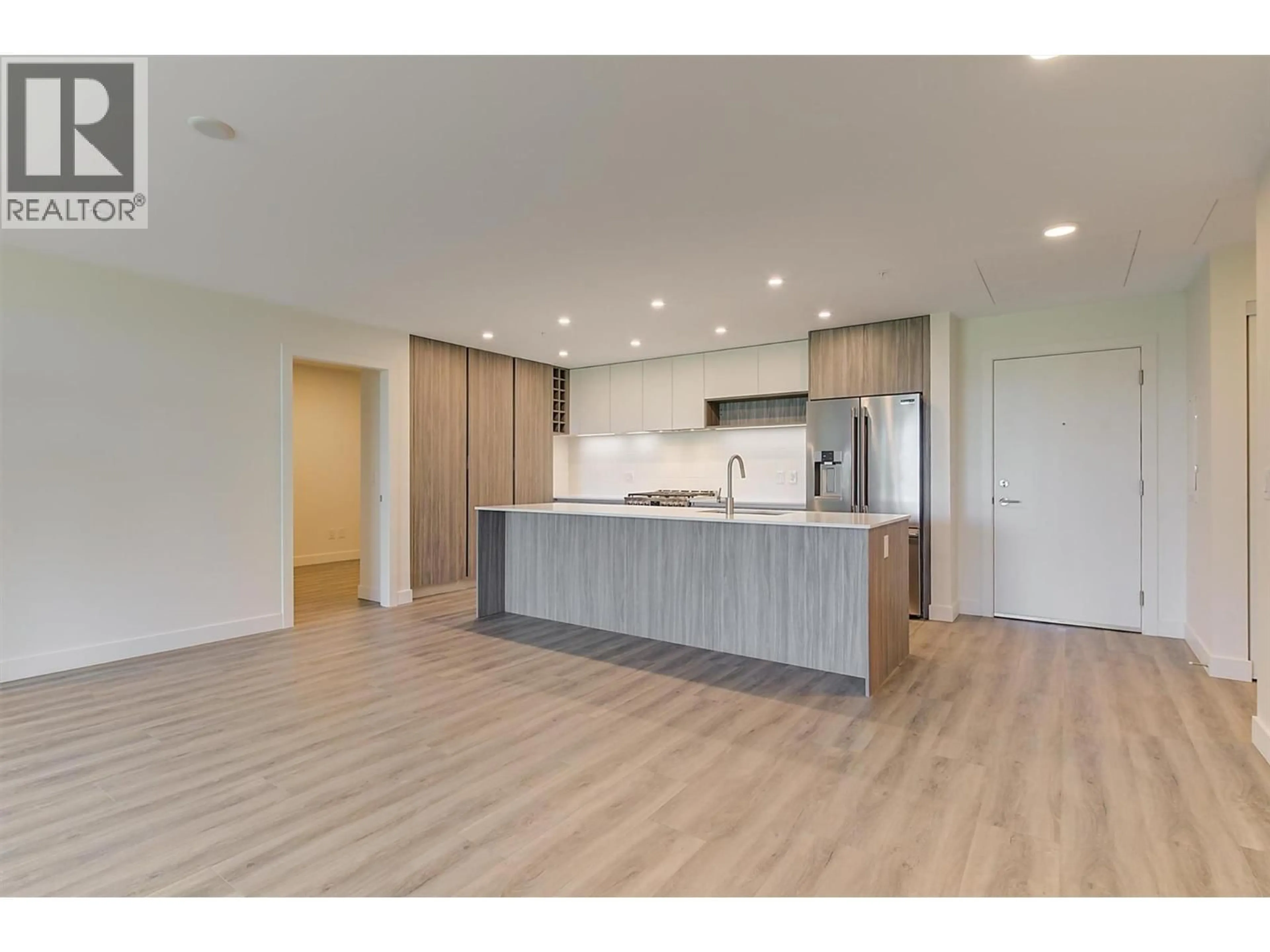 Open concept kitchen, wood/laminate floor for 208 - 2780 OLALLA ROAD, West Kelowna British Columbia V1Z2A9