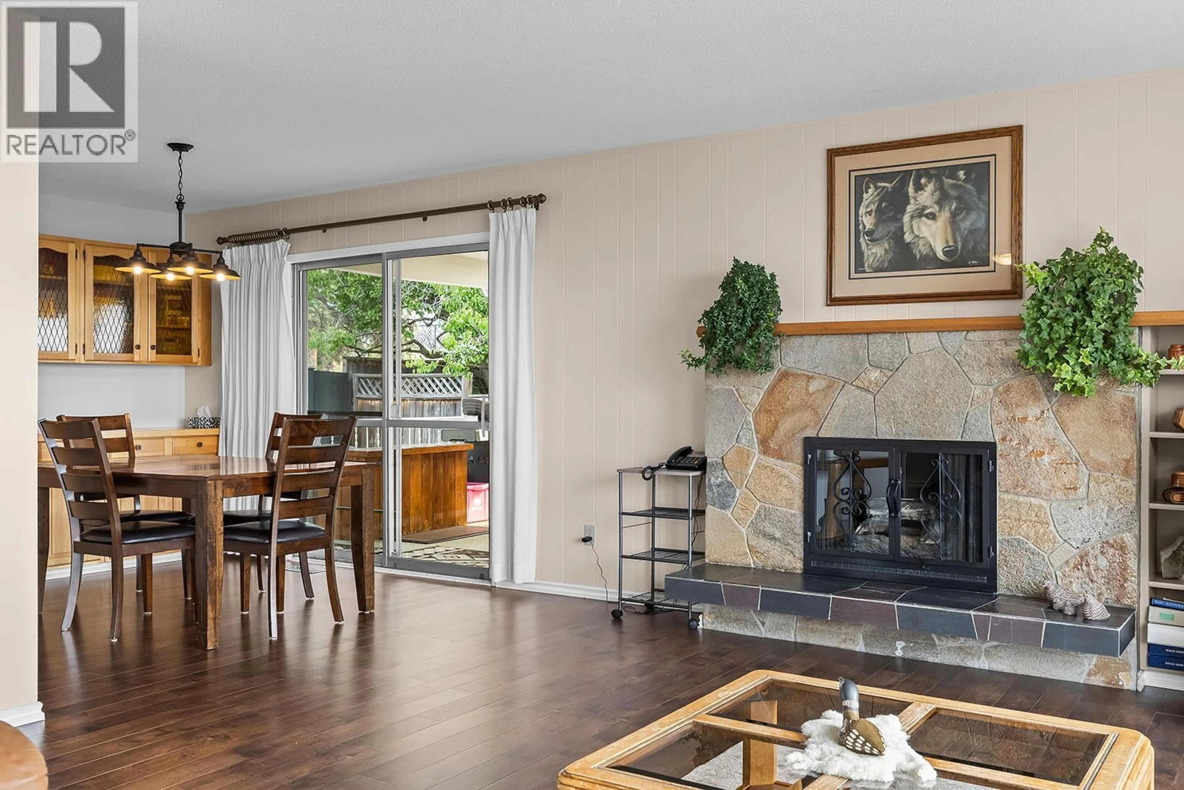 Living room with furniture, wood/laminate floor for 908 STEVENSON ROAD, West Kelowna British Columbia V1Z1N2