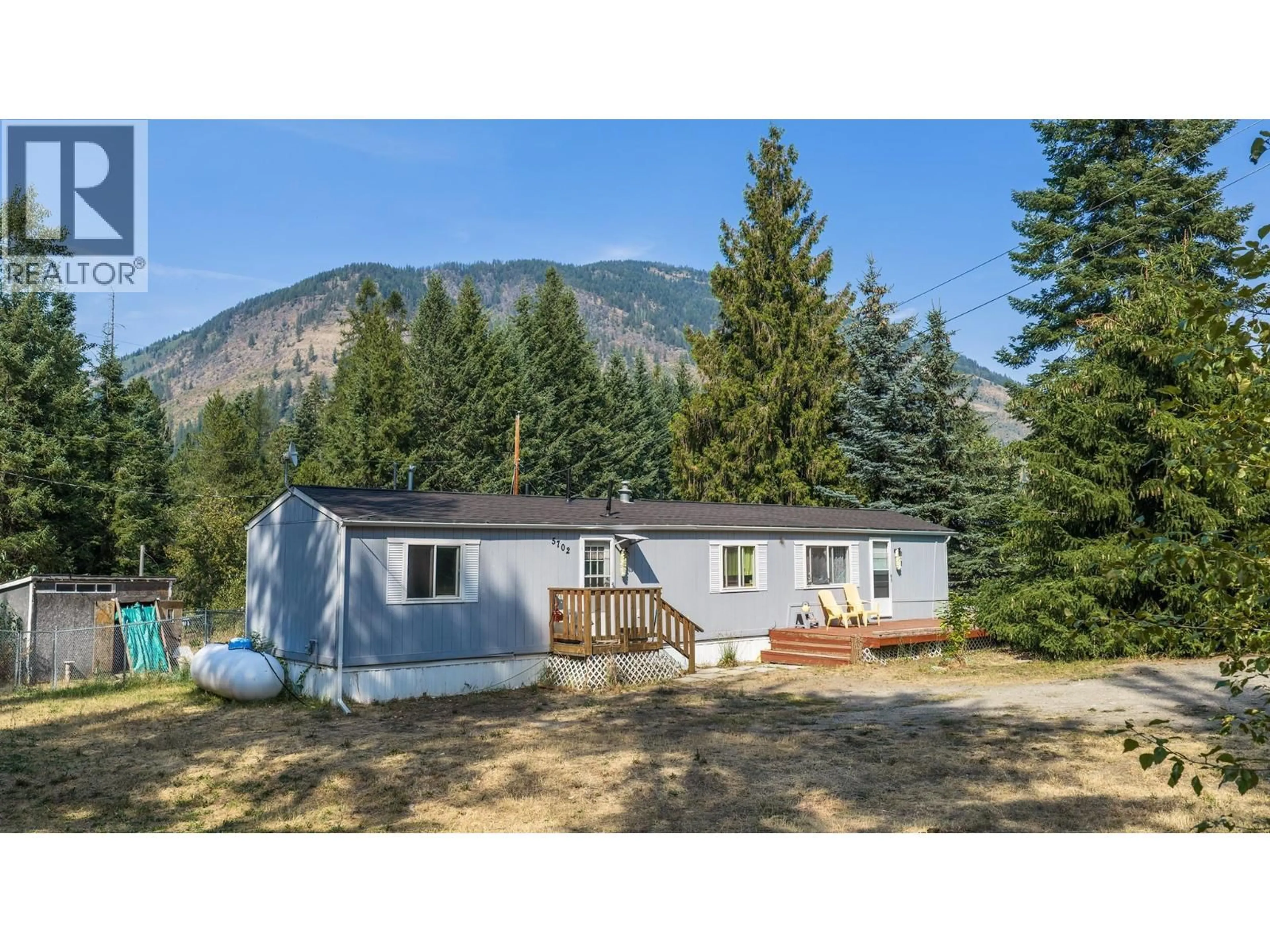 Home with vinyl exterior material, mountain view for 5702 BERTHA ROAD, Kitchener British Columbia V0B1W1