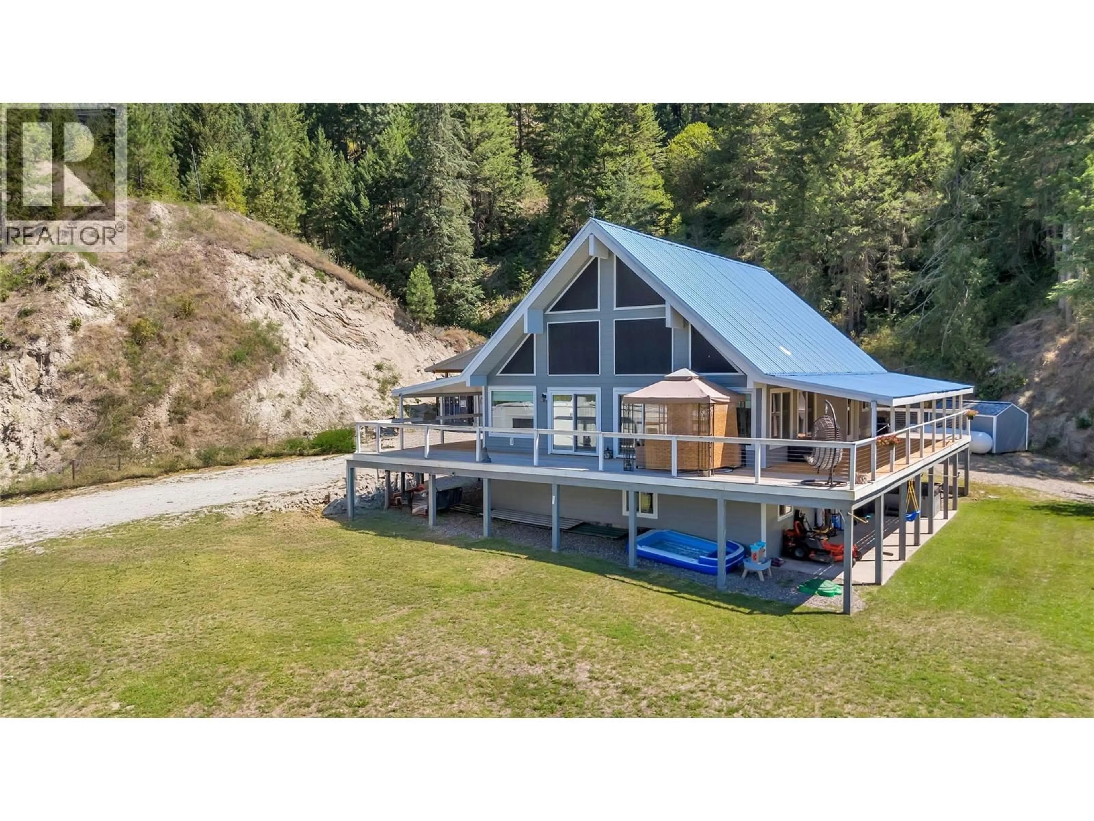A pic from outside/outdoor area/front of a property/back of a property/a pic from drone, water/lake/river/ocean view for 2621 SALMON RIVER ROAD, Salmon Arm British Columbia V1E3H8