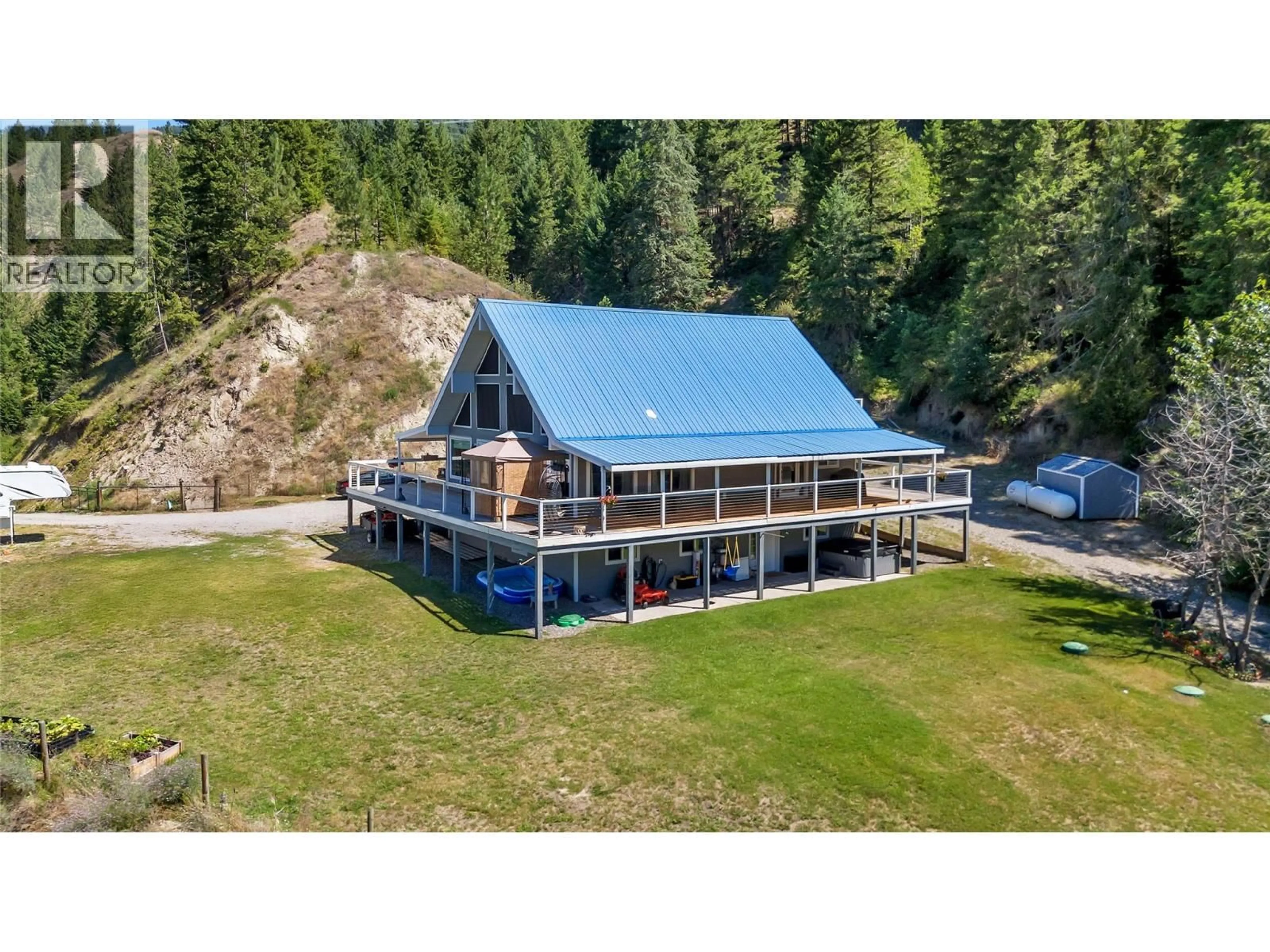 A pic from outside/outdoor area/front of a property/back of a property/a pic from drone, water/lake/river/ocean view for 2621 SALMON RIVER ROAD, Salmon Arm British Columbia V1E3H8