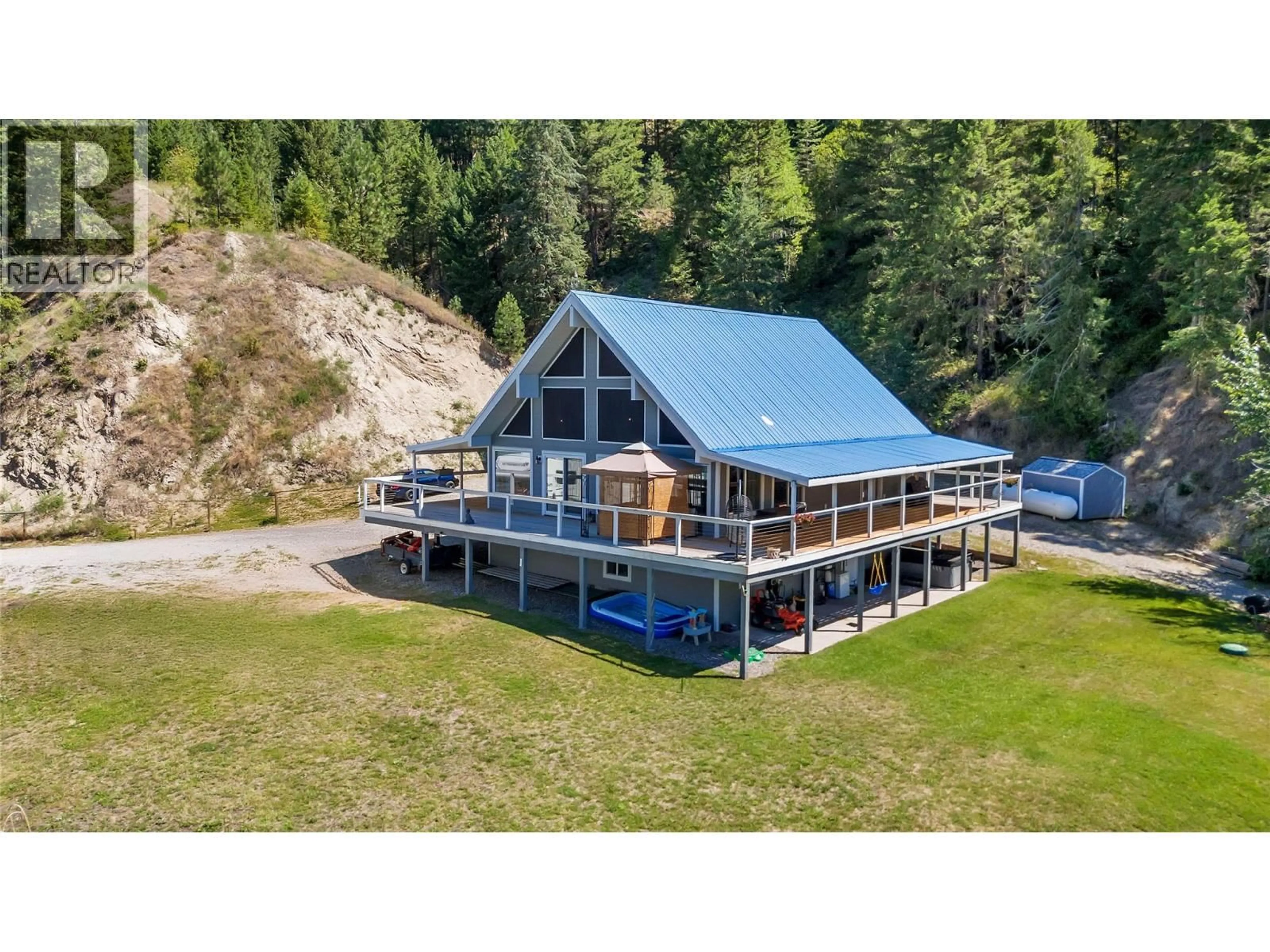 A pic from outside/outdoor area/front of a property/back of a property/a pic from drone, water/lake/river/ocean view for 2621 SALMON RIVER ROAD, Salmon Arm British Columbia V1E3H8