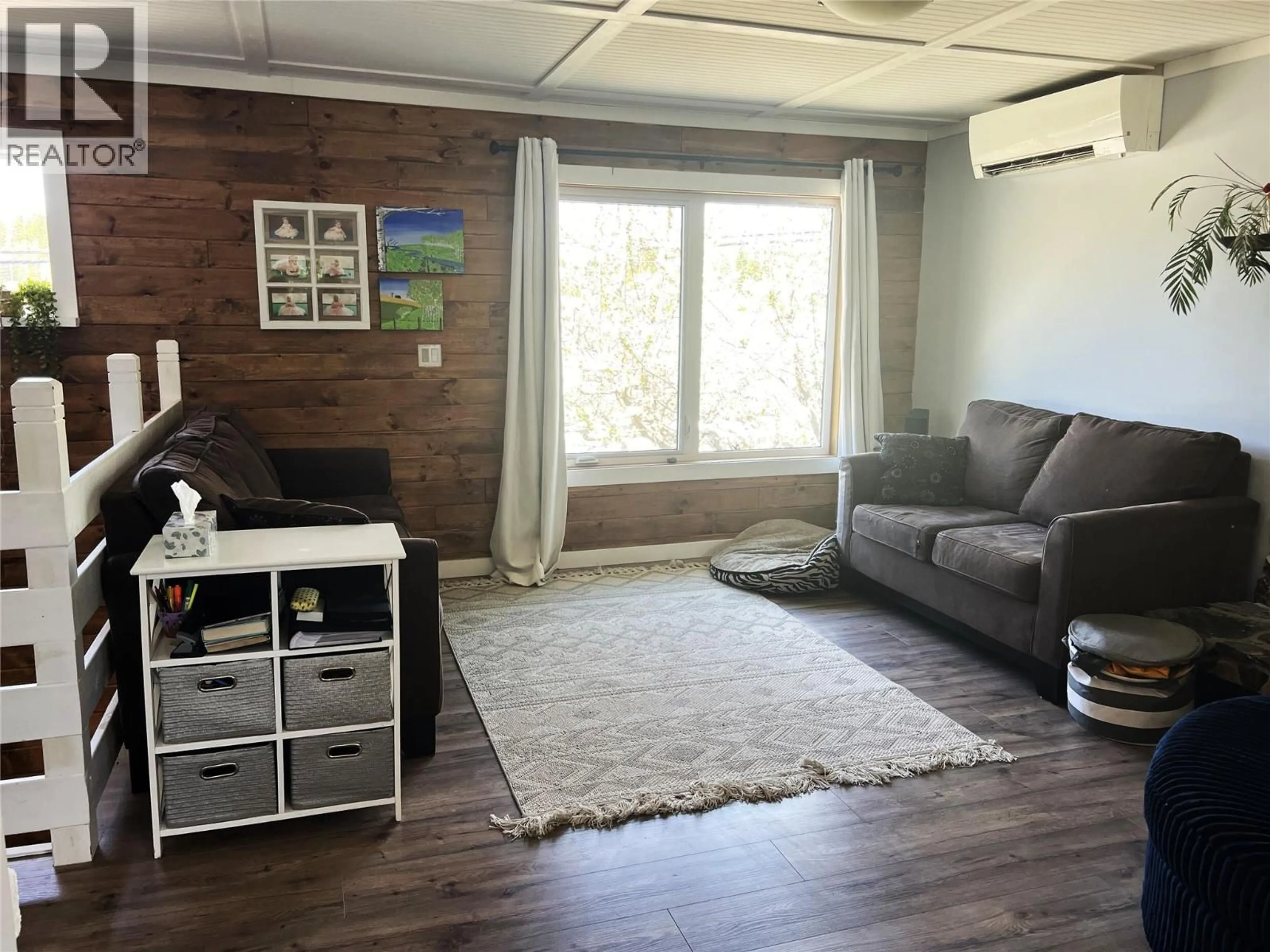 Living room with furniture, wood/laminate floor for 4138 SQUILAX-ANGLEMONT ROAD, Scotch Creek British Columbia V0E1M5