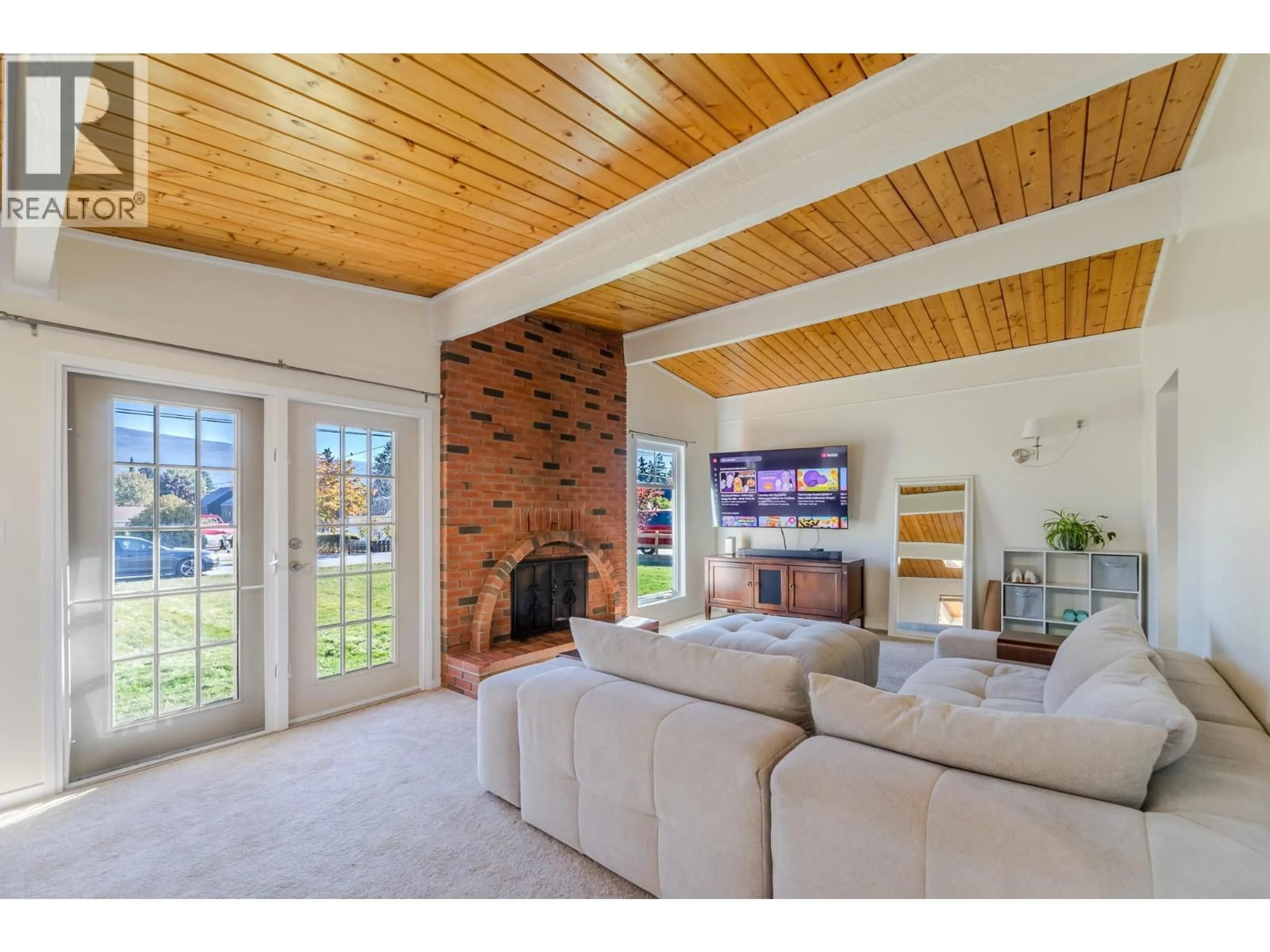 Living room with furniture, wood/laminate floor for 5206 NIXON ROAD, Summerland British Columbia V0H1Z9