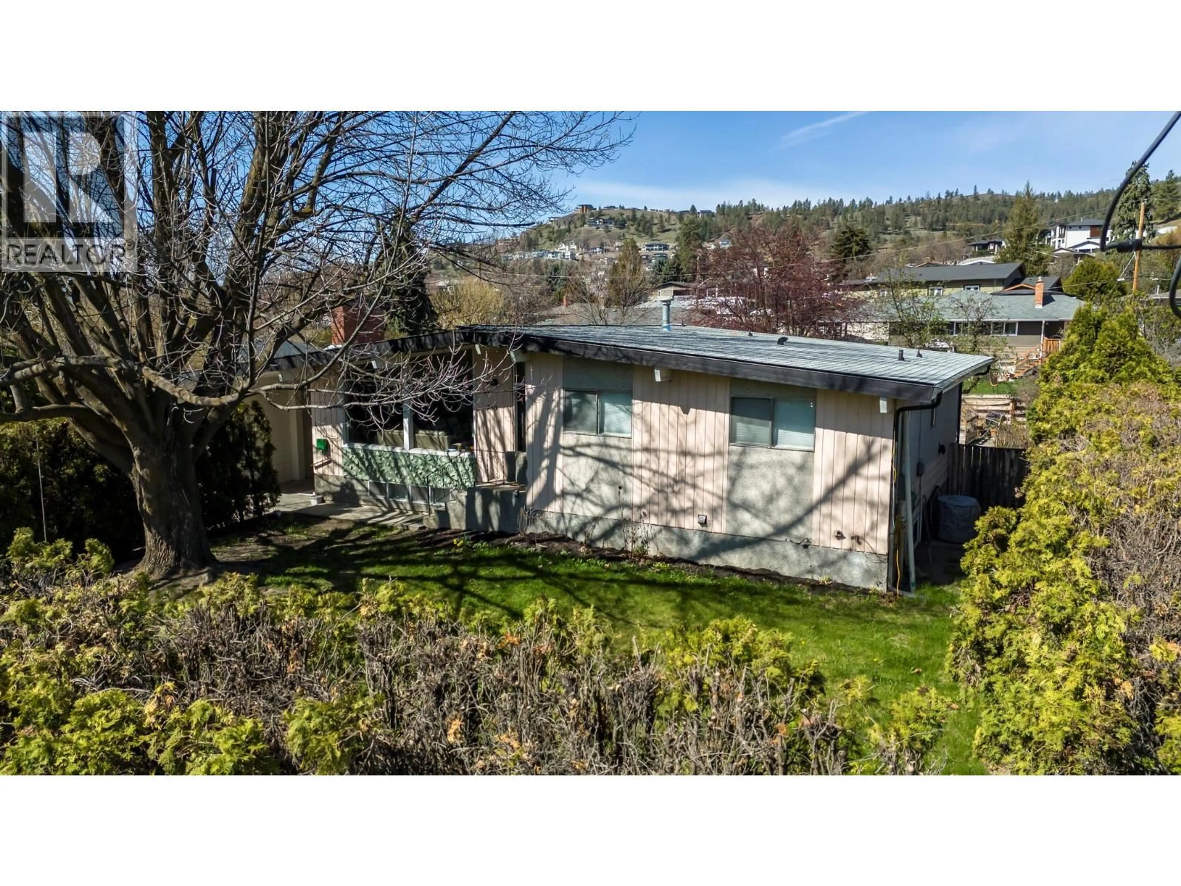 A pic from outside/outdoor area/front of a property/back of a property/a pic from drone, street for 750 GLENMORE DRIVE, Kelowna British Columbia V1Y4N8