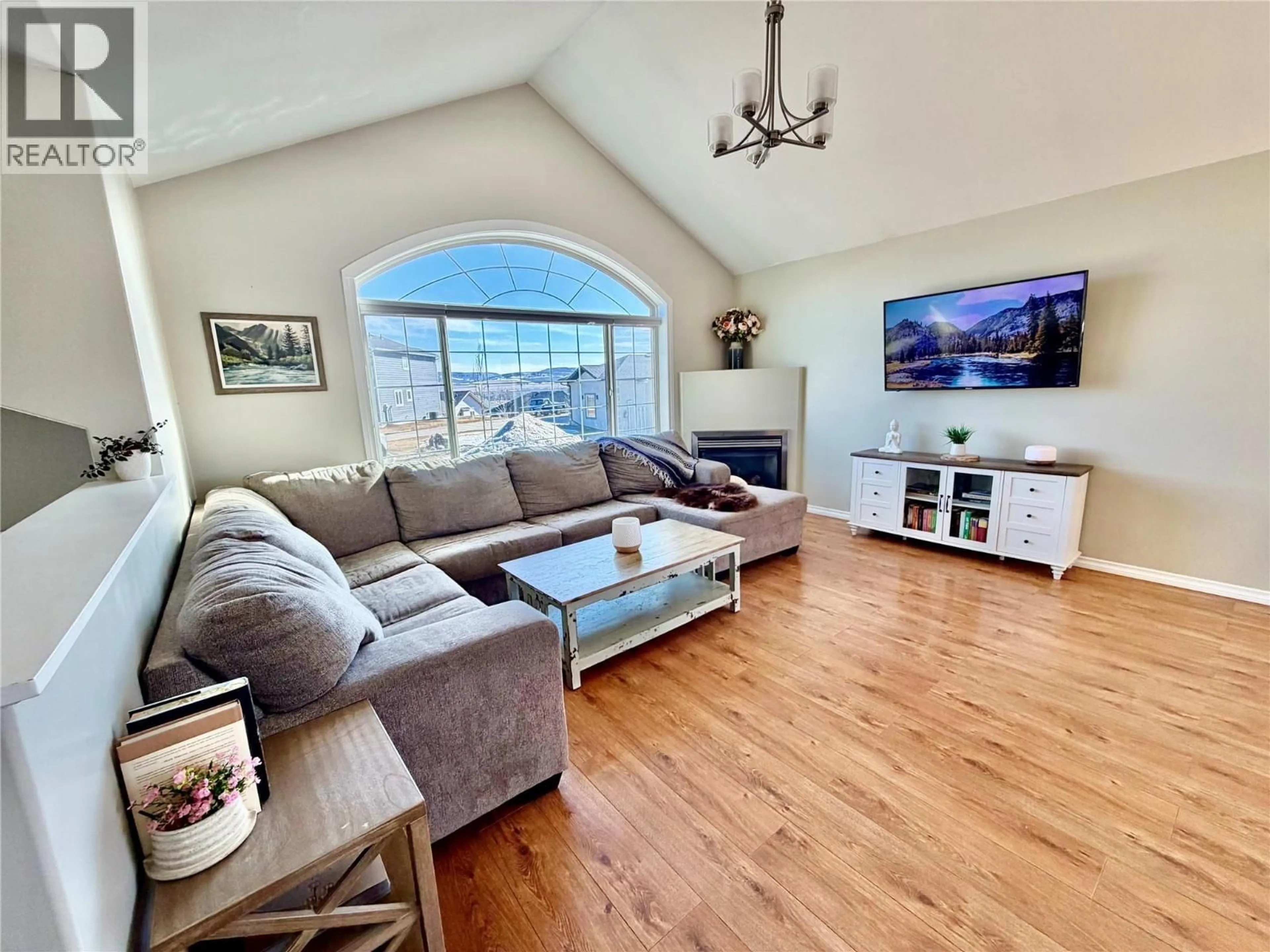Living room with furniture, wood/laminate floor for 1904 91 AVENUE, Dawson Creek British Columbia V1G4E3