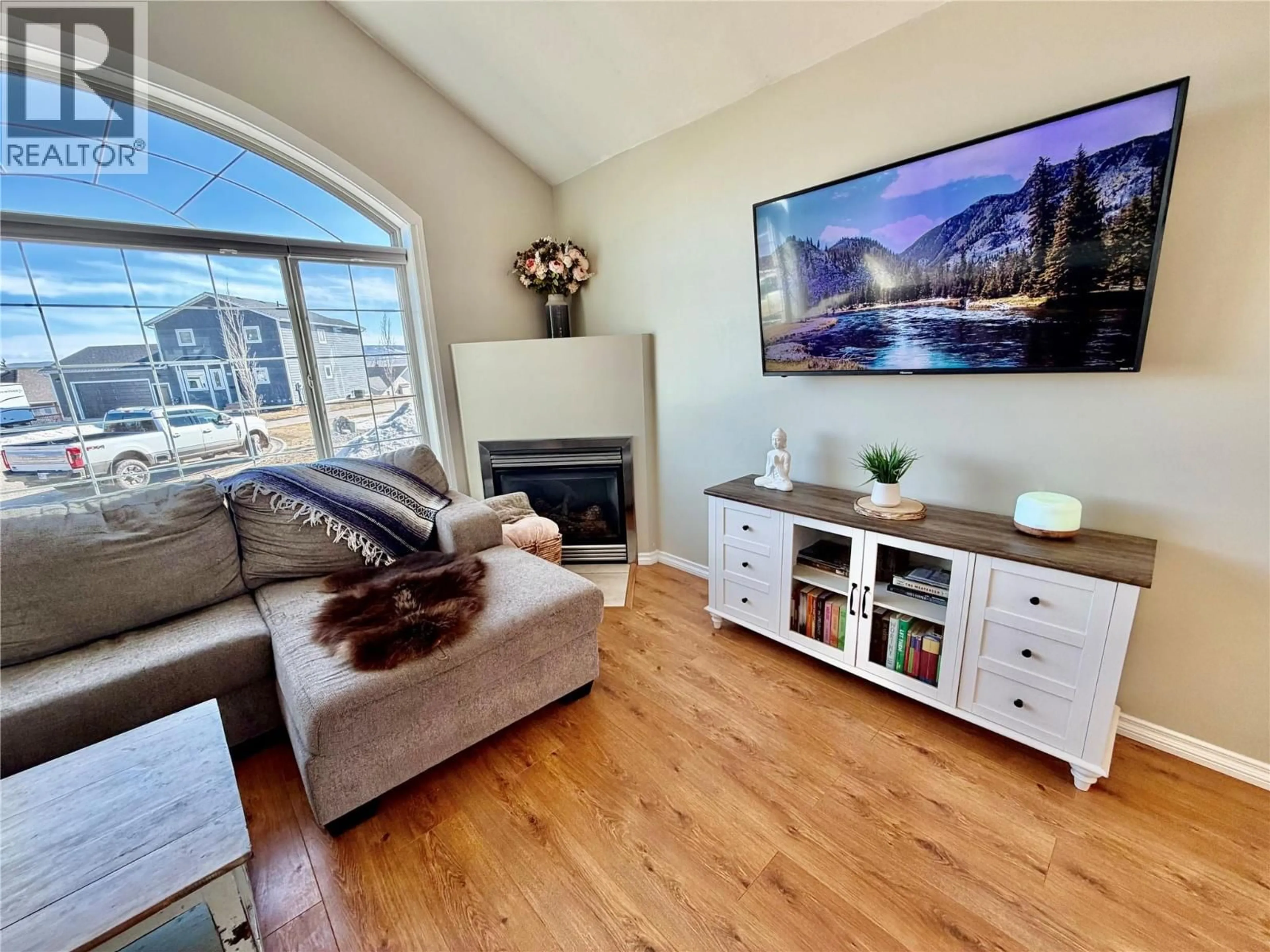 Living room with furniture, wood/laminate floor for 1904 91 AVENUE, Dawson Creek British Columbia V1G4E3