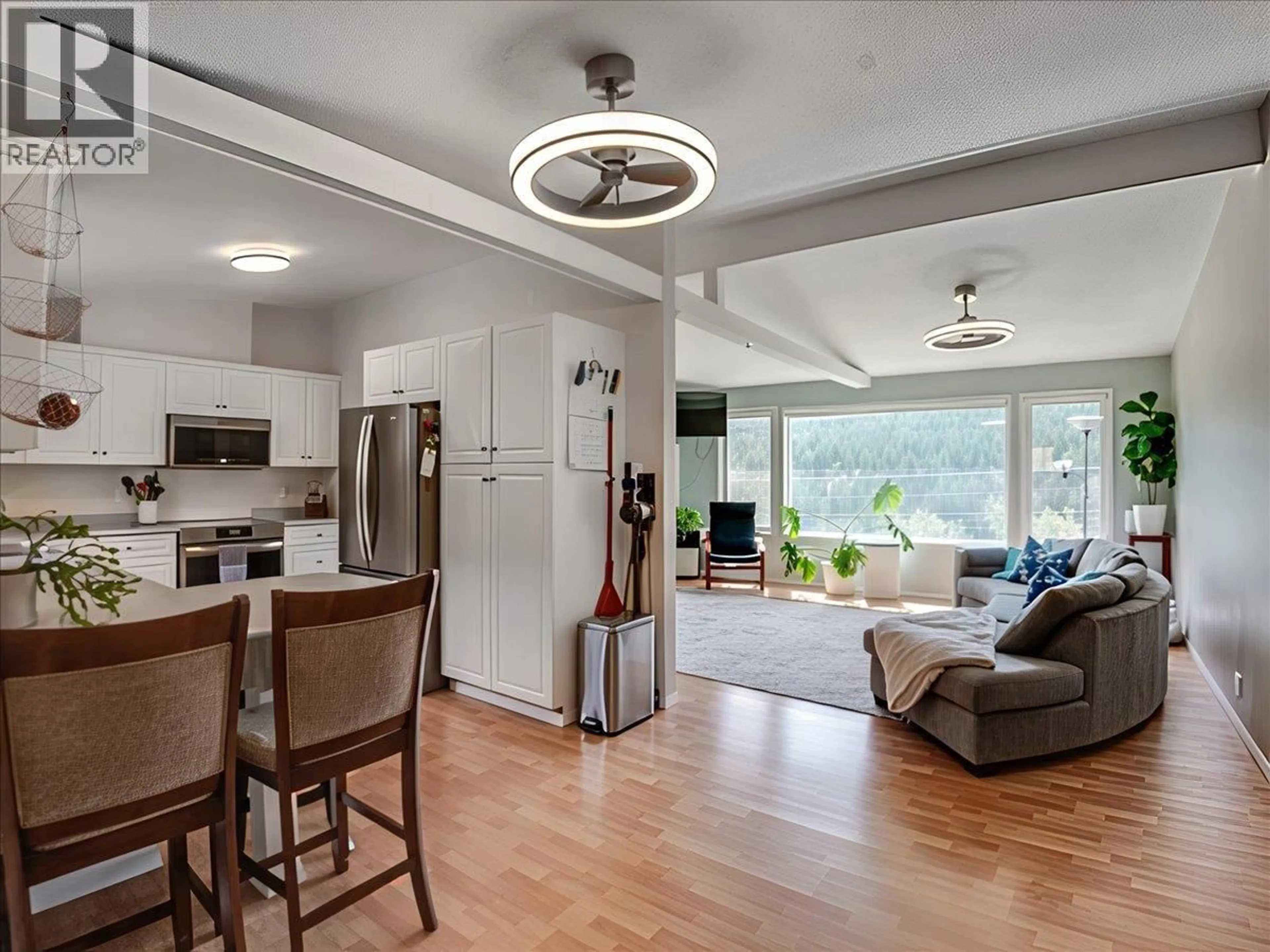 Open concept kitchen, wood/laminate floor for 8392 THEATRE ROAD, Trail British Columbia V1R4W2