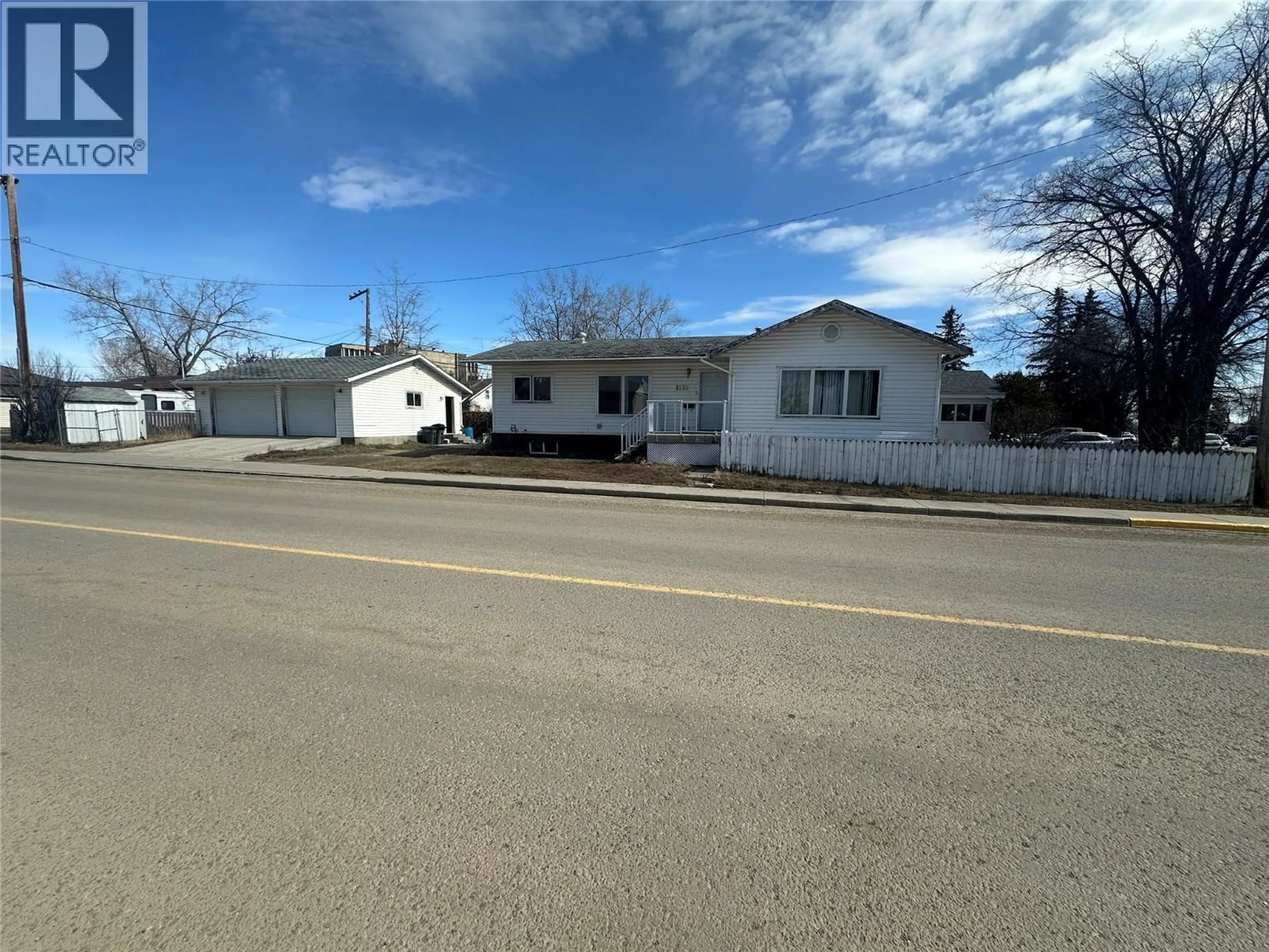 A pic from outside/outdoor area/front of a property/back of a property/a pic from drone, street for 1232 105 AVENUE, Dawson Creek British Columbia V1G2L7