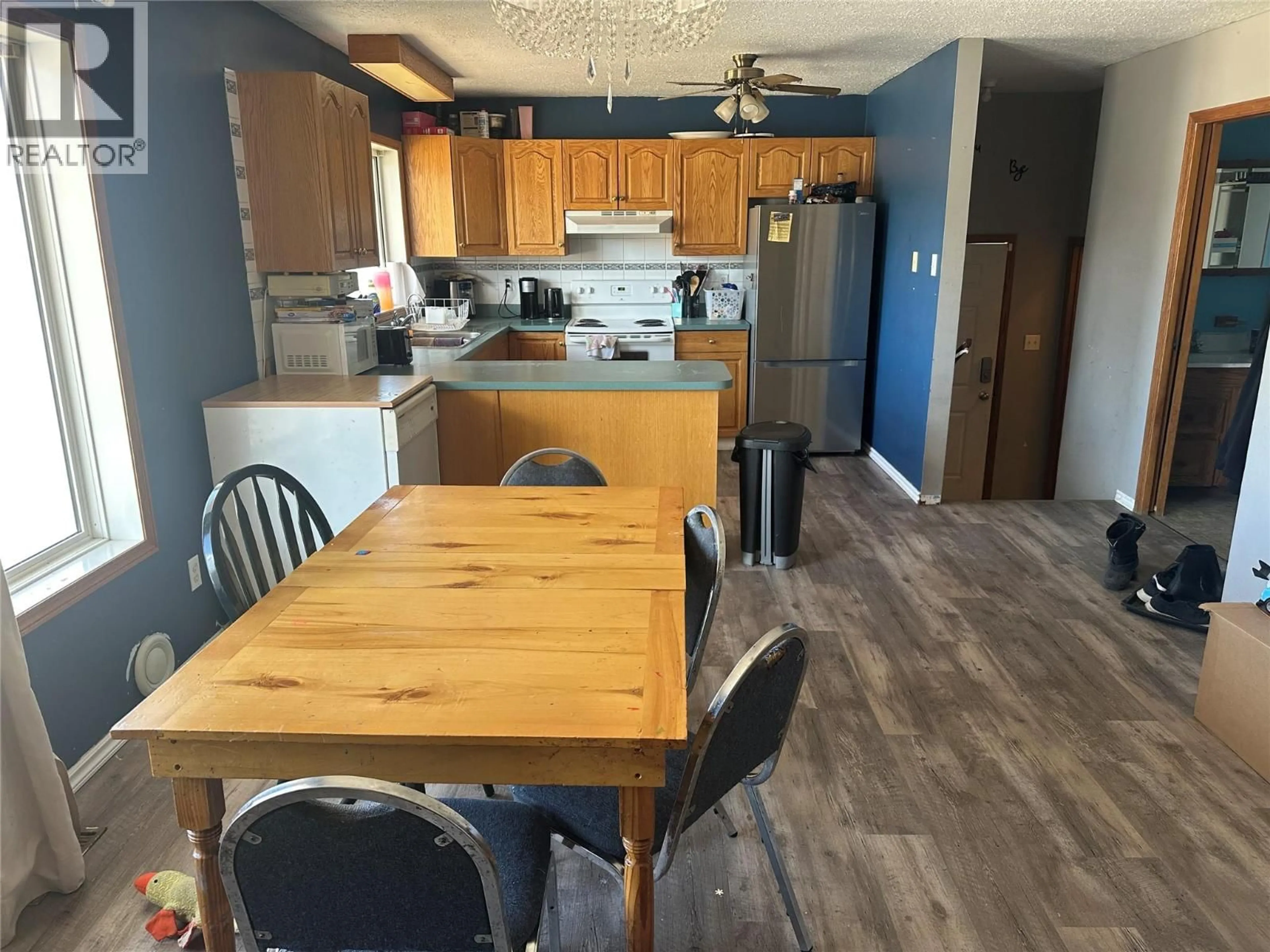 Open concept kitchen, wood/laminate floor for 1232 105 AVENUE, Dawson Creek British Columbia V1G2L7
