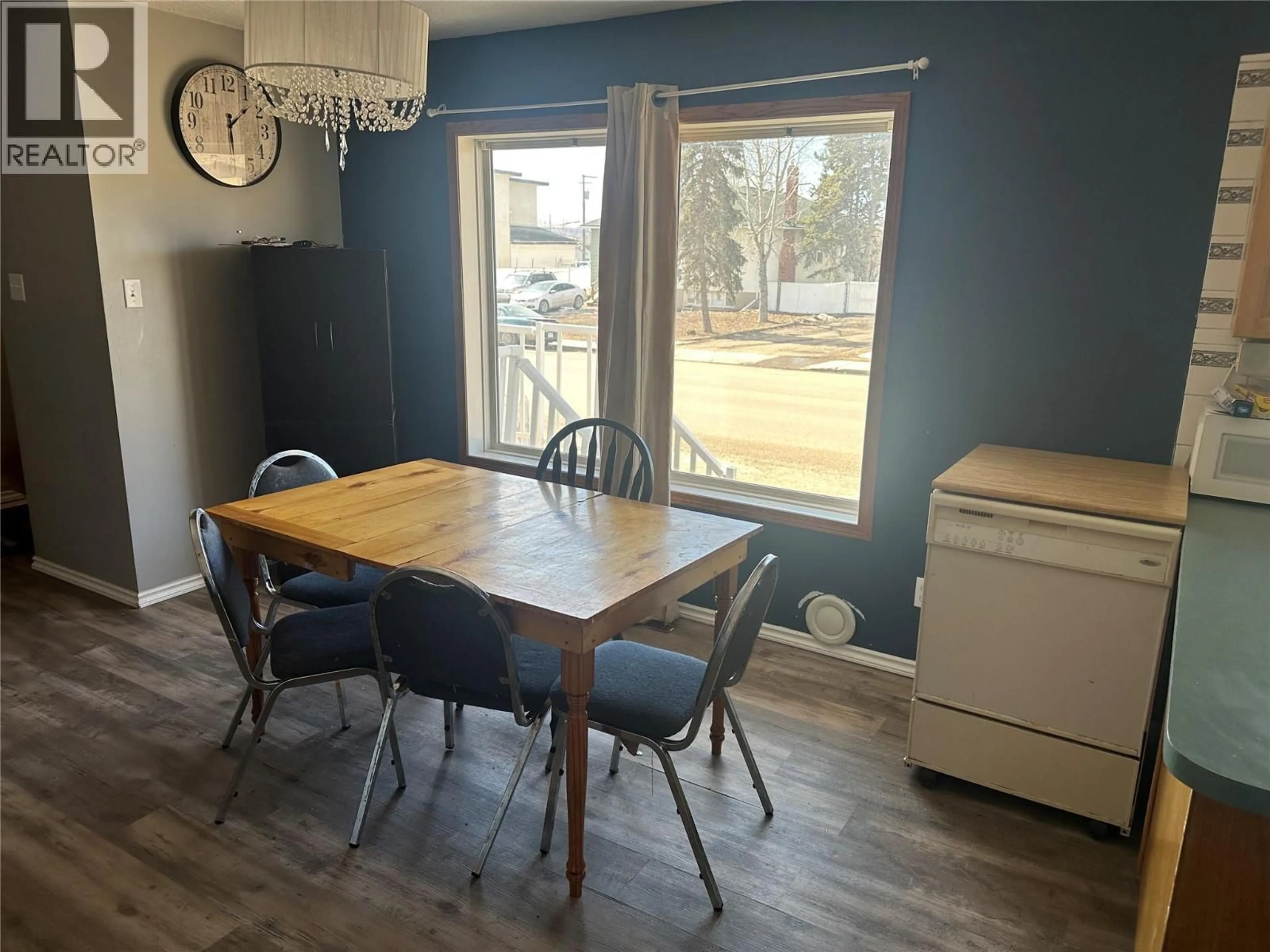 Dining room, wood/laminate floor for 1232 105 AVENUE, Dawson Creek British Columbia V1G2L7
