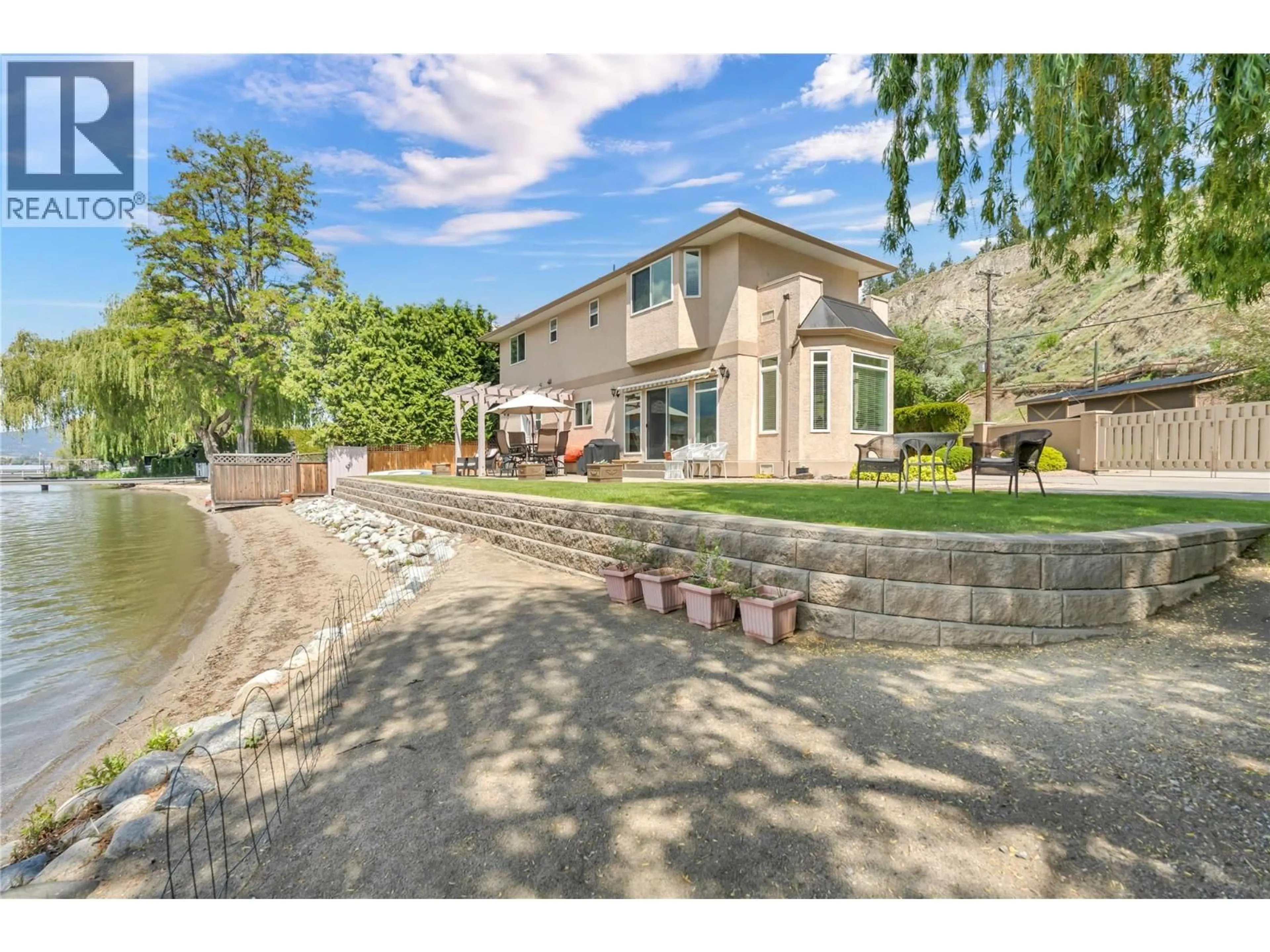 A pic from outside/outdoor area/front of a property/back of a property/a pic from drone, street for 4597 LAKESIDE ROAD, Penticton British Columbia V2A8W4