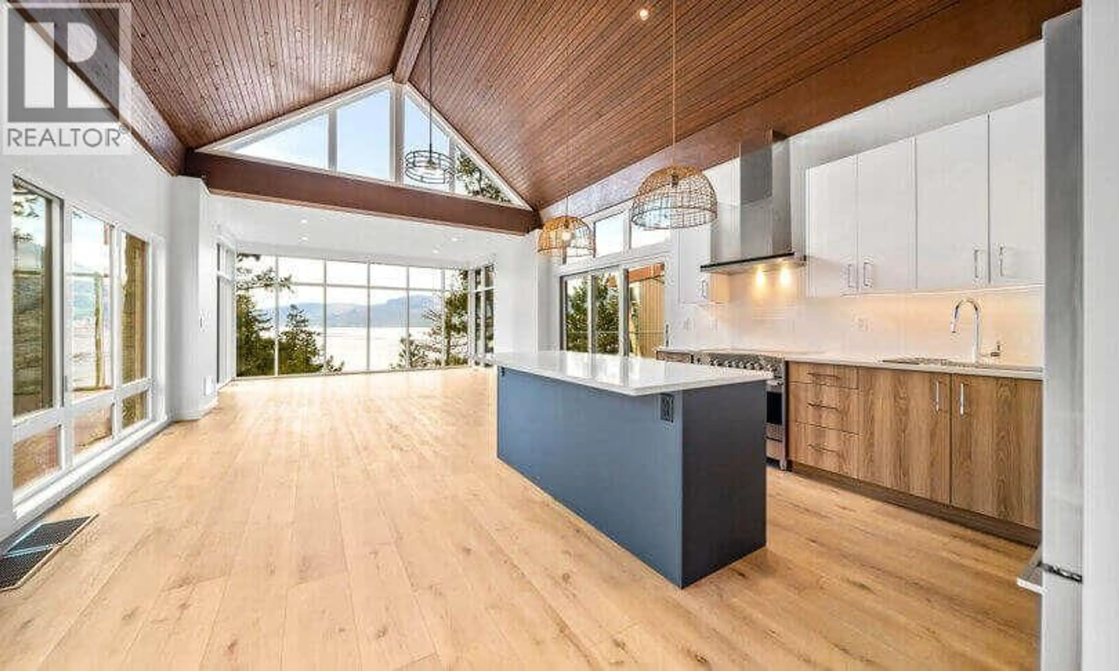 Open concept kitchen, wood/laminate floor for 163 - 9845 EASTSIDE ROAD, Vernon British Columbia V1H1Z2