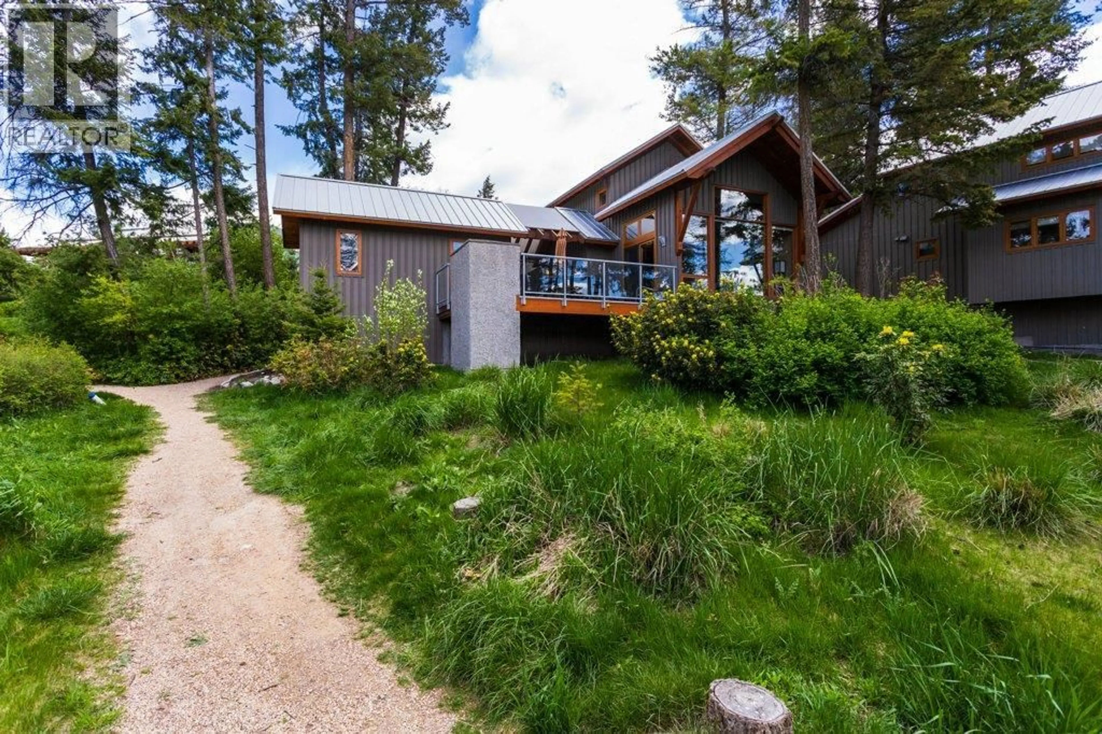 A pic from outside/outdoor area/front of a property/back of a property/a pic from drone, unknown for 35 - 9845 EASTSIDE ROAD, Vernon British Columbia V1H1Z2