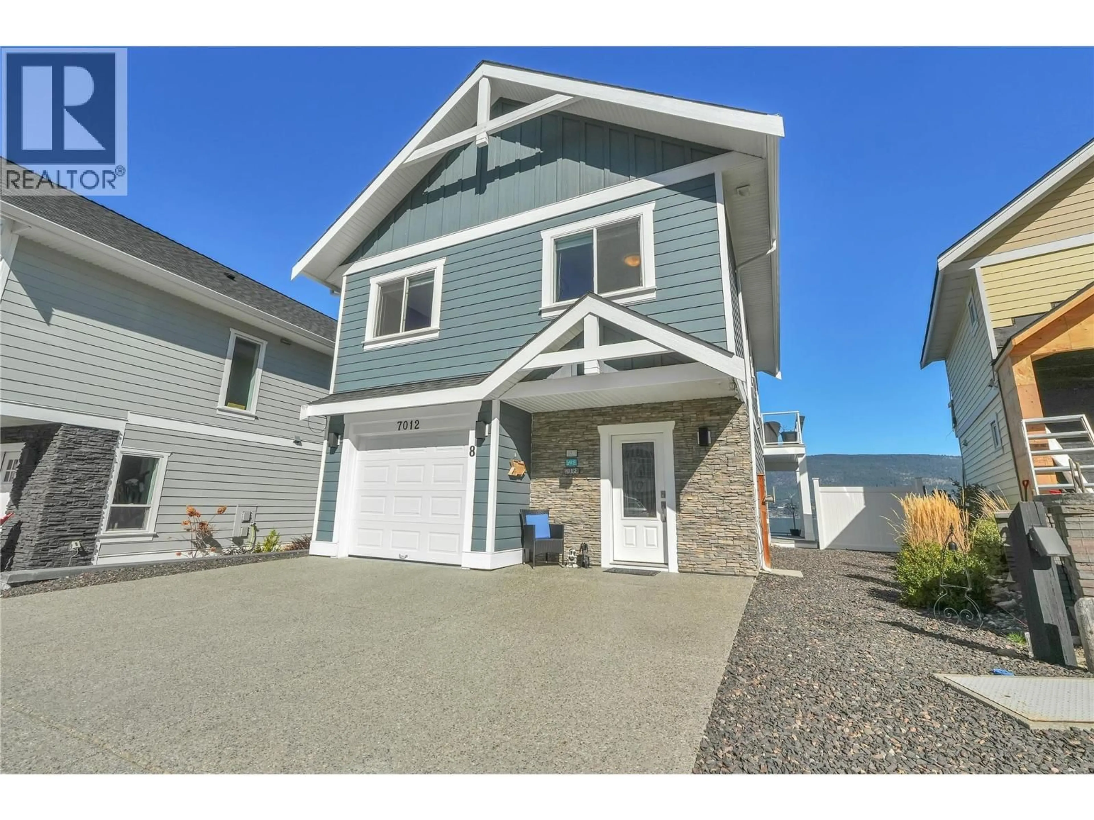 Home with vinyl exterior material, street for 7012 BARCELONA DRIVE, Kelowna British Columbia v1z3r8