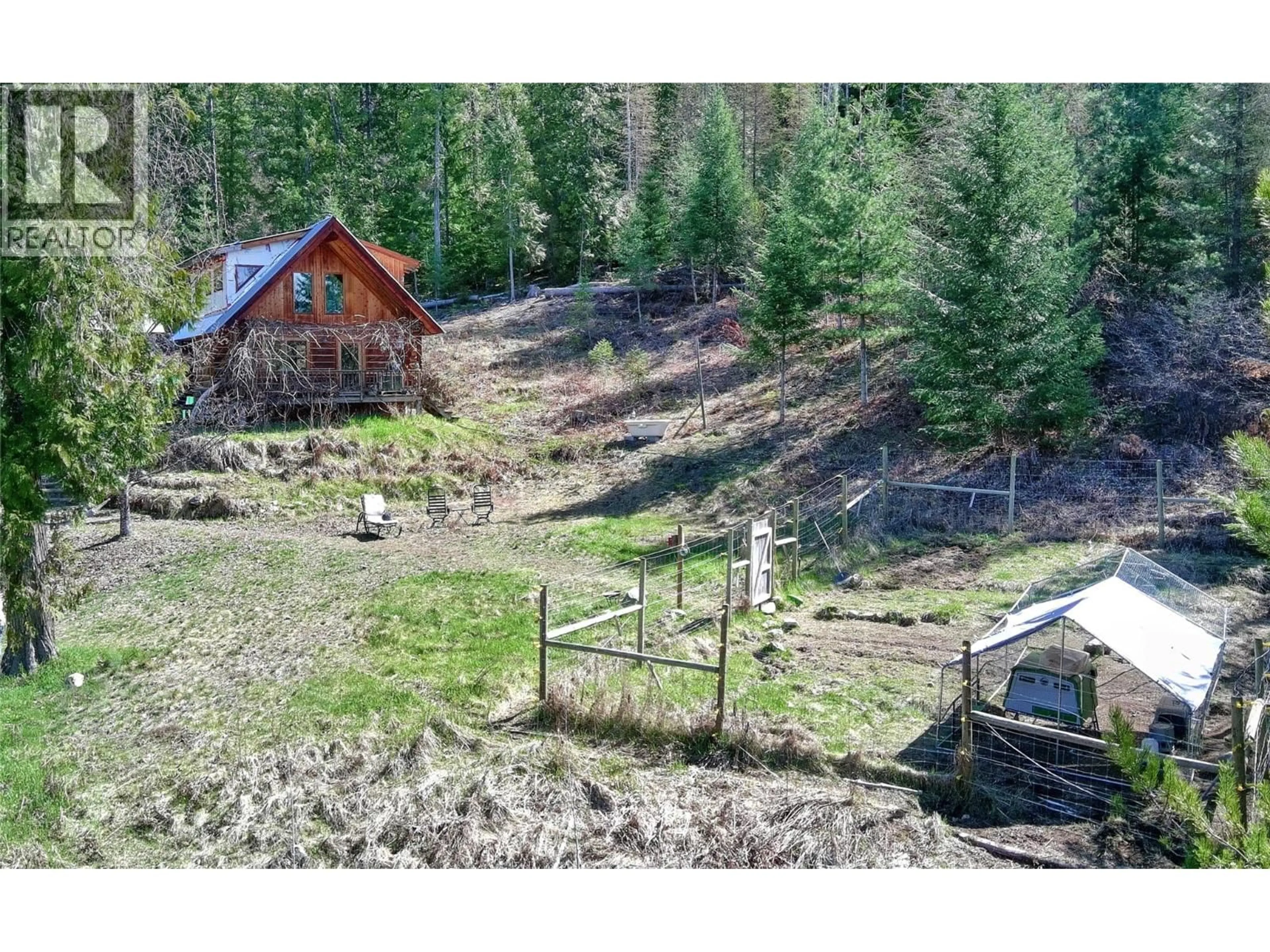 A pic from outside/outdoor area/front of a property/back of a property/a pic from drone, forest/trees view for 8907 MARTENS ROAD, Slocan British Columbia V0G2C0
