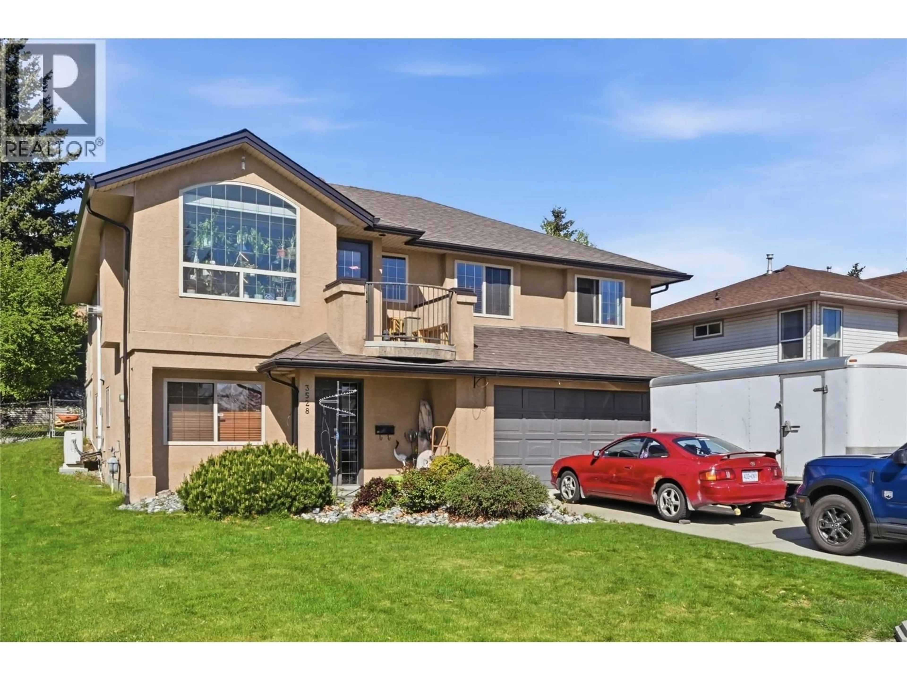 Home with vinyl exterior material, street for 3528 GLEN EAGLES DRIVE, West Kelowna British Columbia V4T2L6