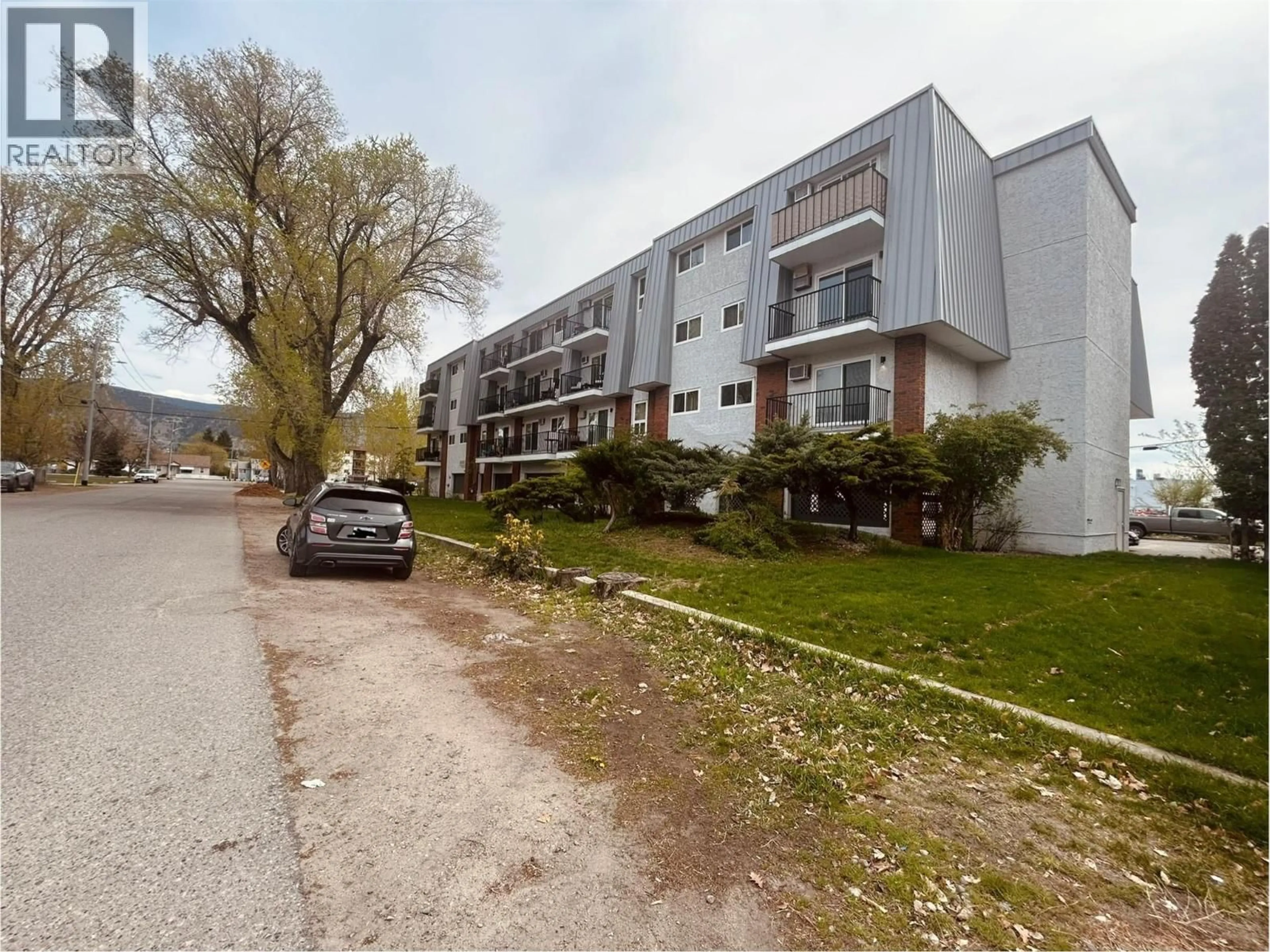 A pic from outside/outdoor area/front of a property/back of a property/a pic from drone, street for 208 - 922 DYNES AVENUE, Penticton British Columbia V2A1E8