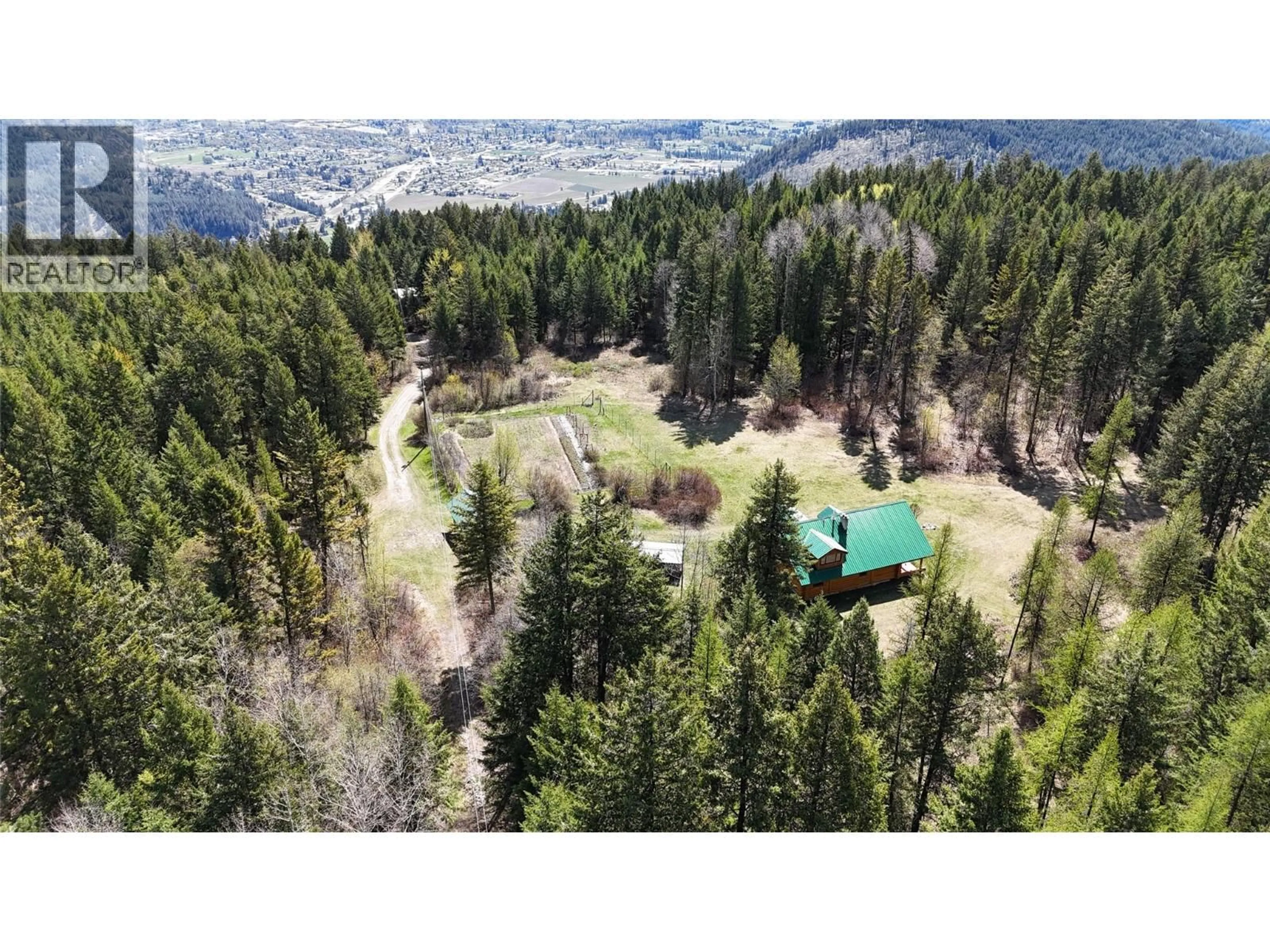 A pic from outside/outdoor area/front of a property/back of a property/a pic from drone, forest/trees view for 5200 HARDY MOUNTAIN ROAD, Grand Forks British Columbia V0H1H2