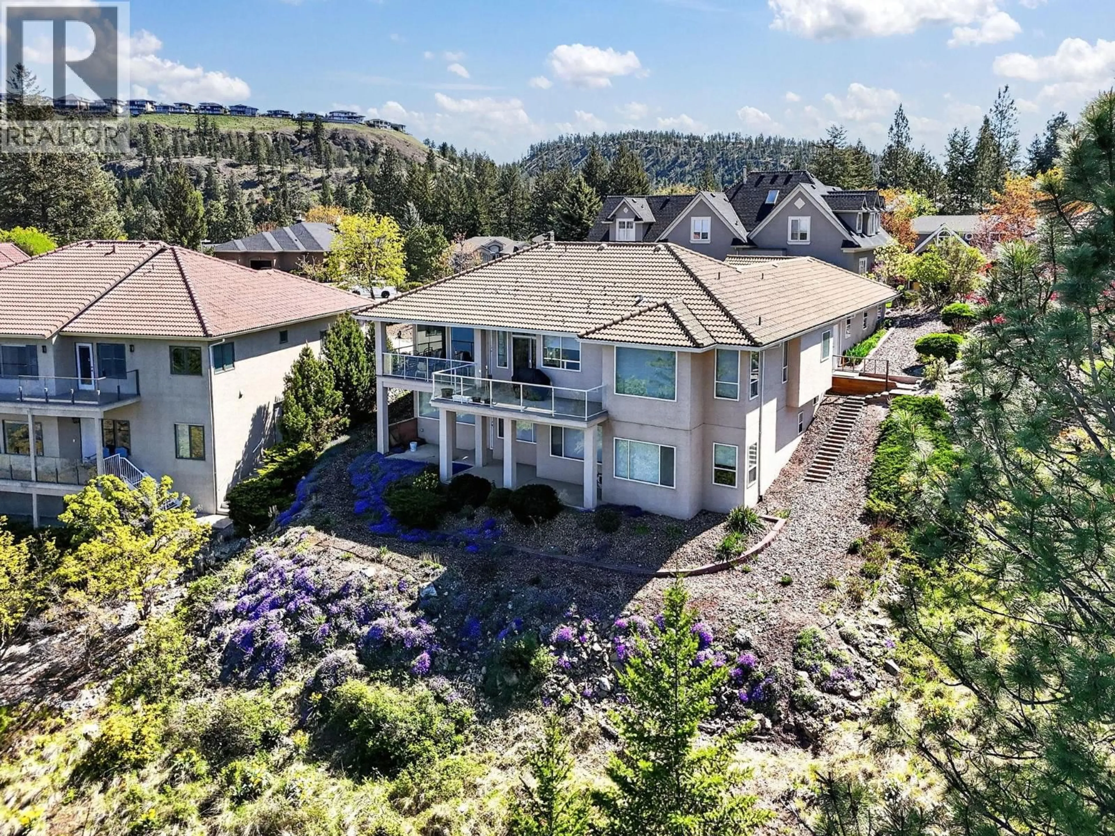 A pic from outside/outdoor area/front of a property/back of a property/a pic from drone, mountain view for 248 PENDRAGON PLACE, Kelowna British Columbia V1V1N2