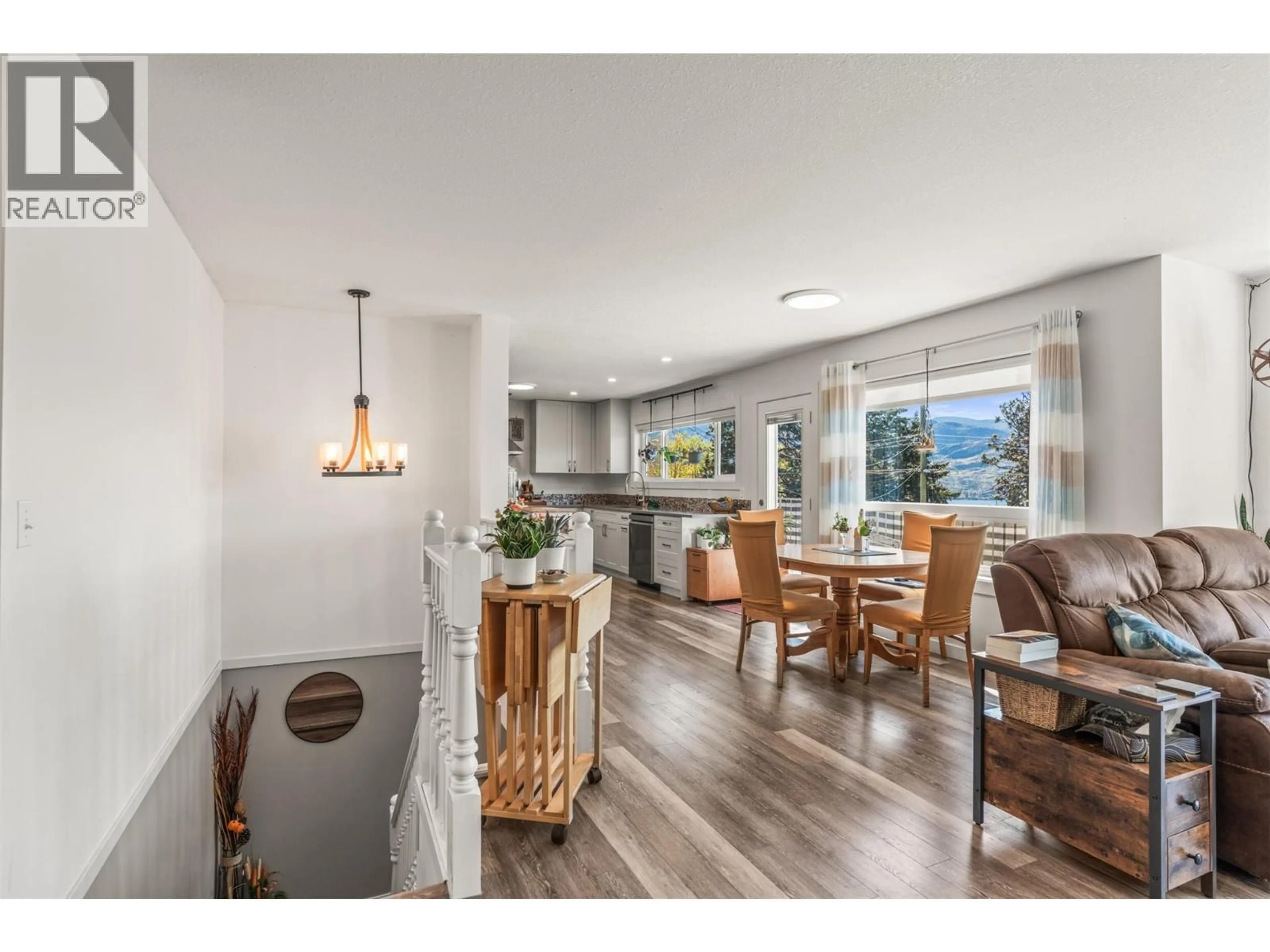 Open concept kitchen, wood/laminate floor for 4138 4TH AVENUE, Peachland British Columbia V0H1X5