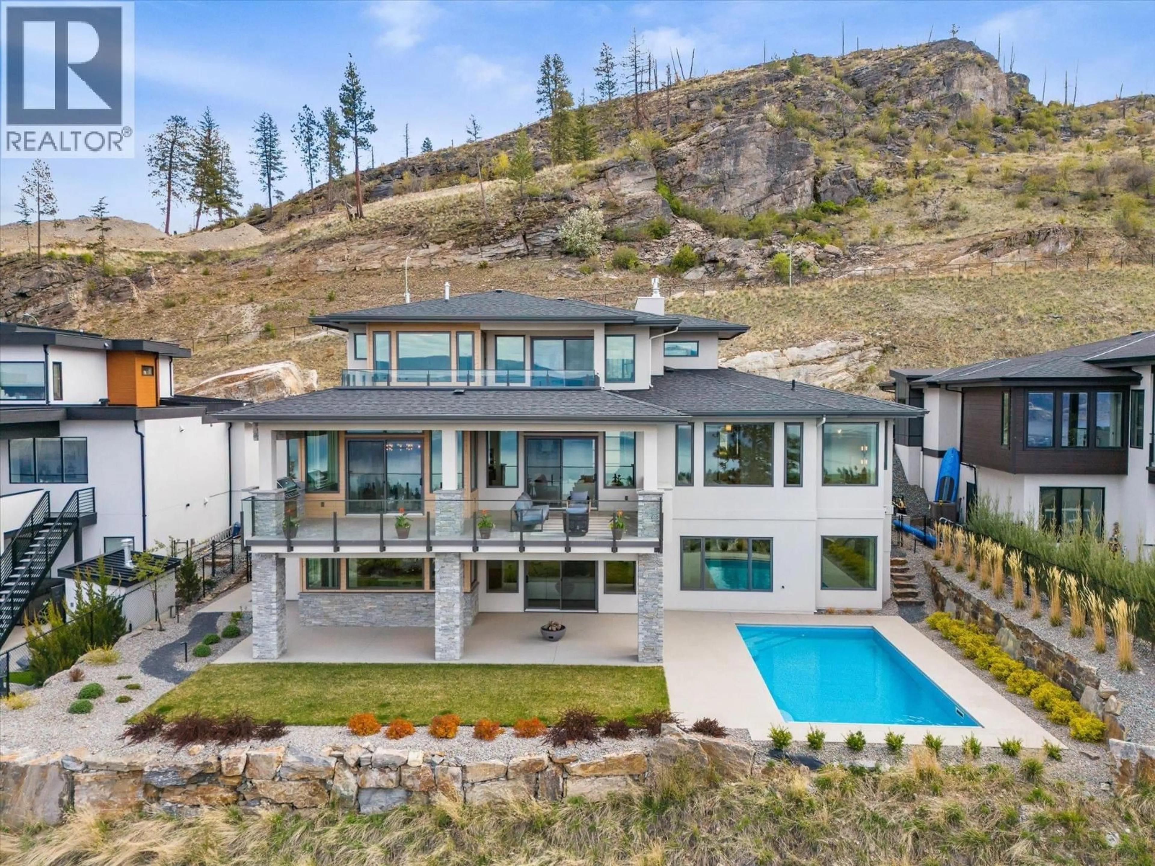 A pic from outside/outdoor area/front of a property/back of a property/a pic from drone, mountain view for 110 - 5650 THE EDGE PLACE, Kelowna British Columbia V1W5M4