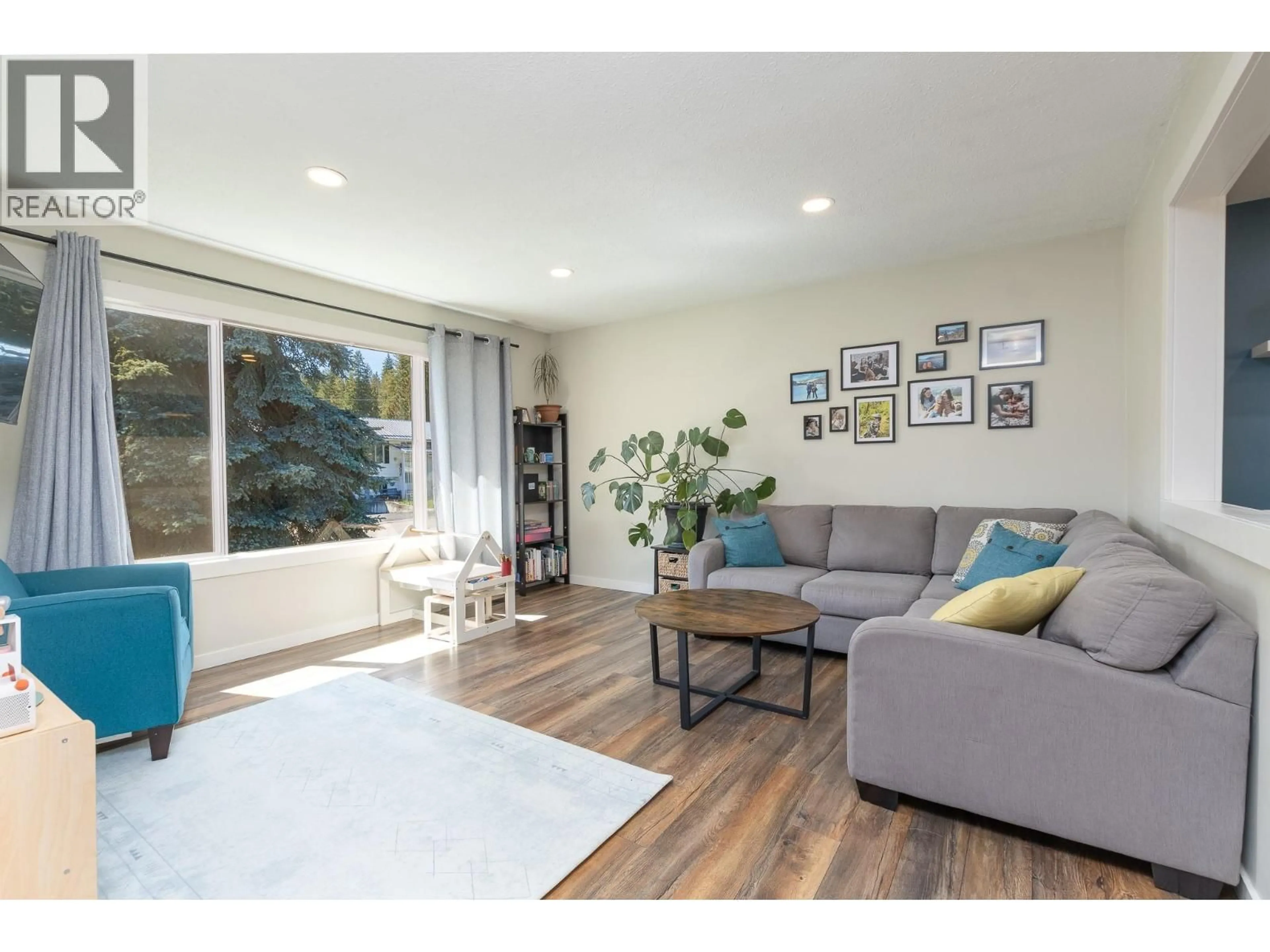 Living room with furniture, wood/laminate floor for 4751 71 AVENUE NORTHEAST, Salmon Arm British Columbia V0E1K0