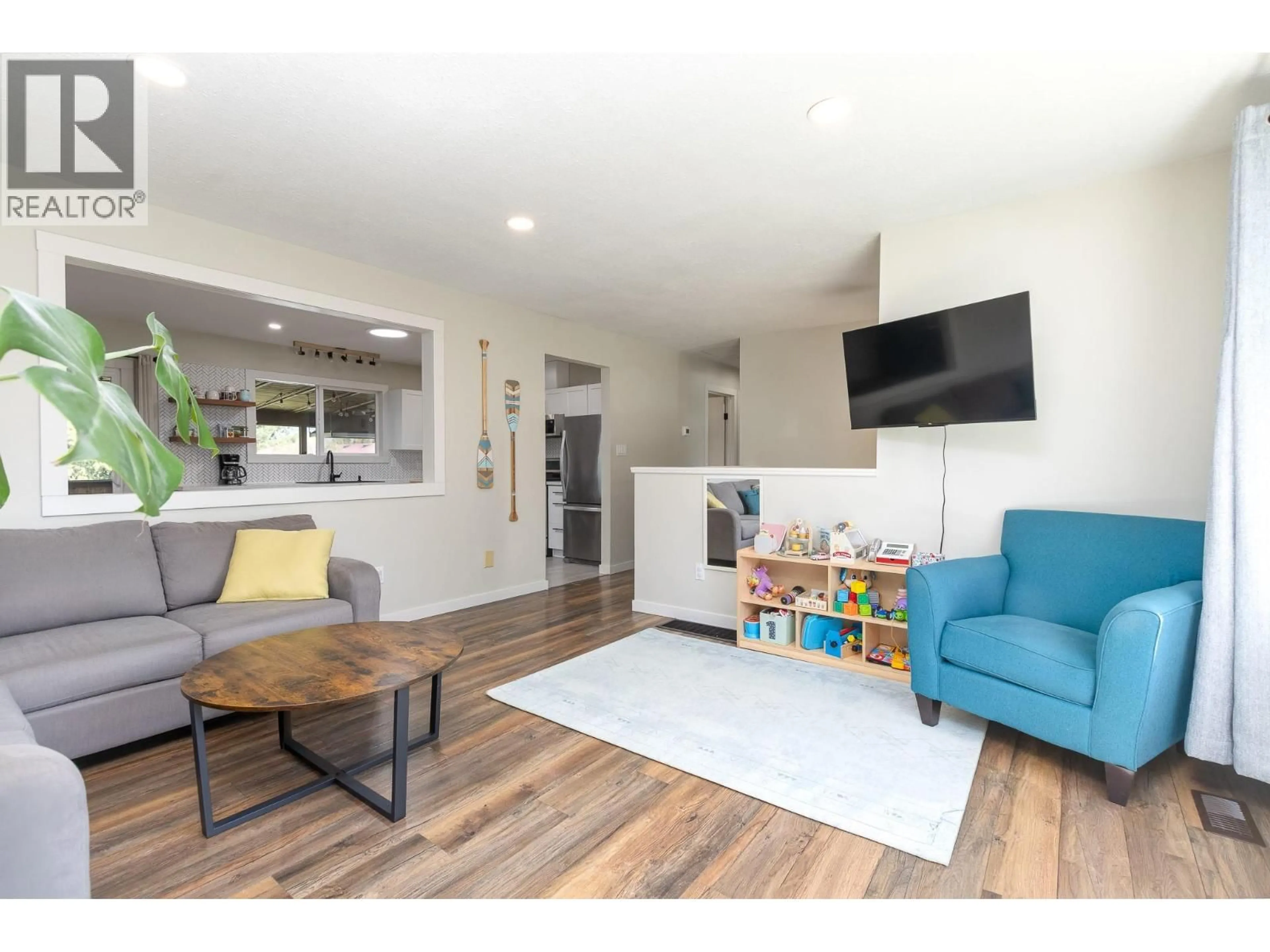 Living room with furniture, wood/laminate floor for 4751 71 AVENUE NORTHEAST, Salmon Arm British Columbia V0E1K0