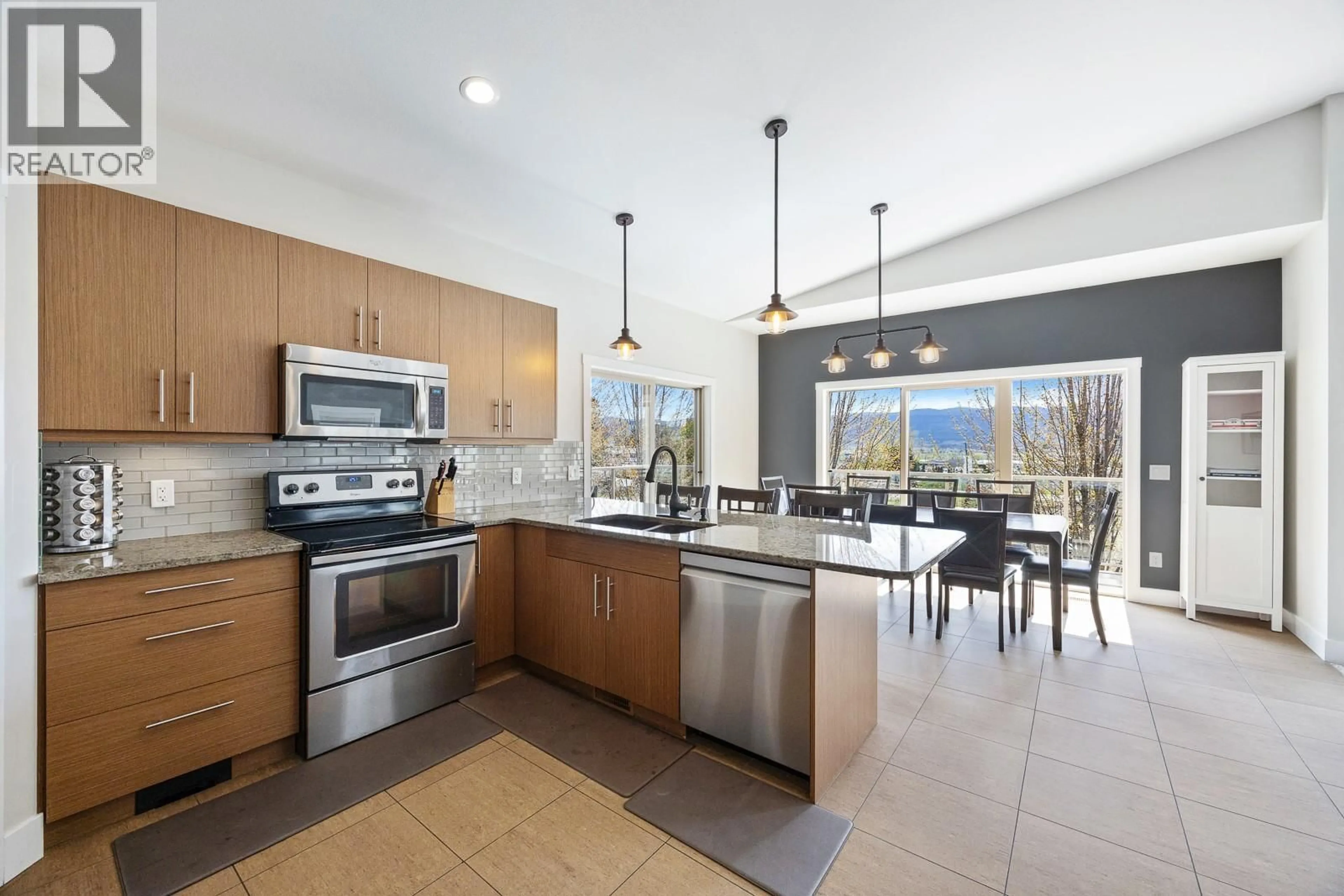 Open concept kitchen, ceramic/tile floor for 3007 SHETLAND ROAD, Kelowna British Columbia V1V3A7