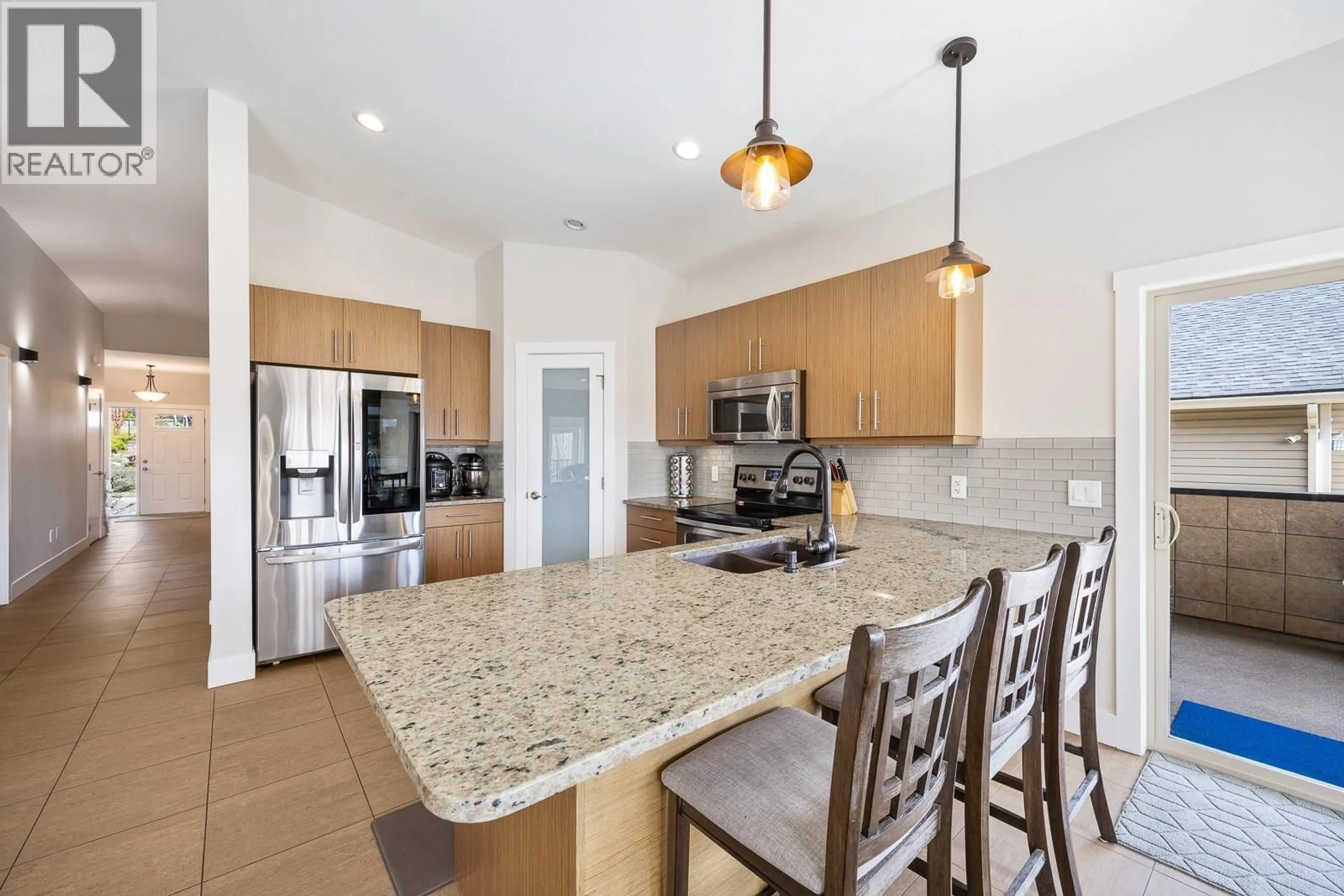 Open concept kitchen, ceramic/tile floor for 3007 SHETLAND ROAD, Kelowna British Columbia V1V3A7
