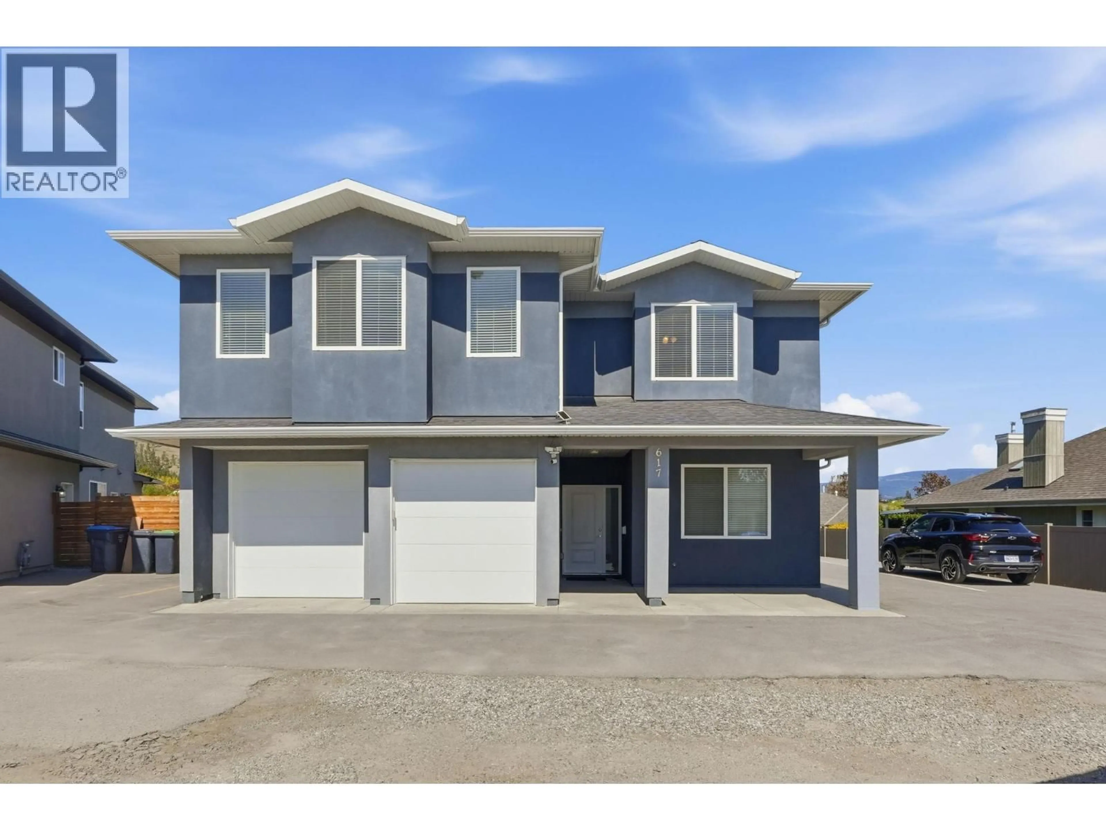 Home with vinyl exterior material, street for 617 GLENMORE ROAD, Kelowna British Columbia V1V2H4