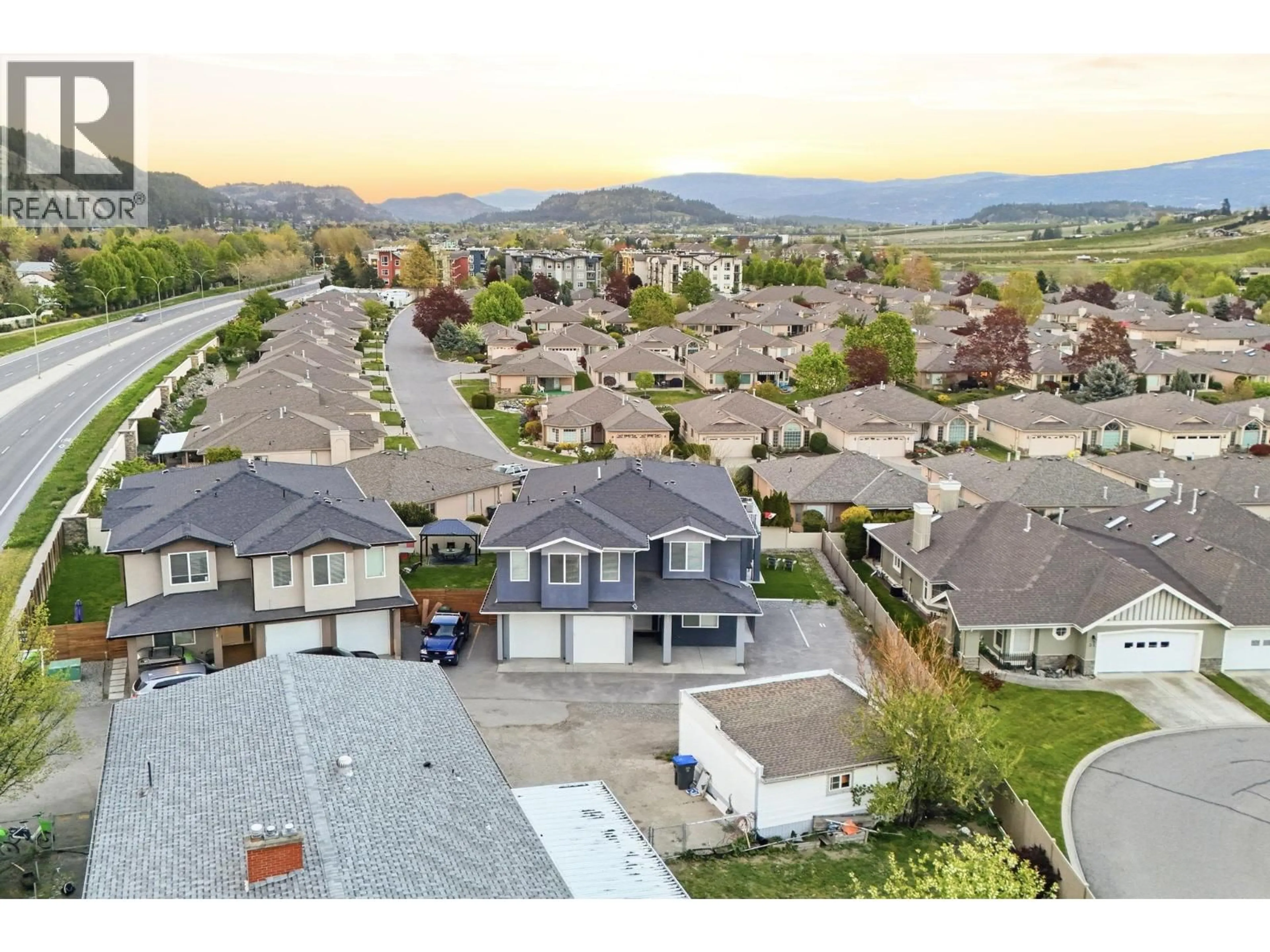 A pic from outside/outdoor area/front of a property/back of a property/a pic from drone, mountain view for 617 GLENMORE ROAD, Kelowna British Columbia V1V2H4