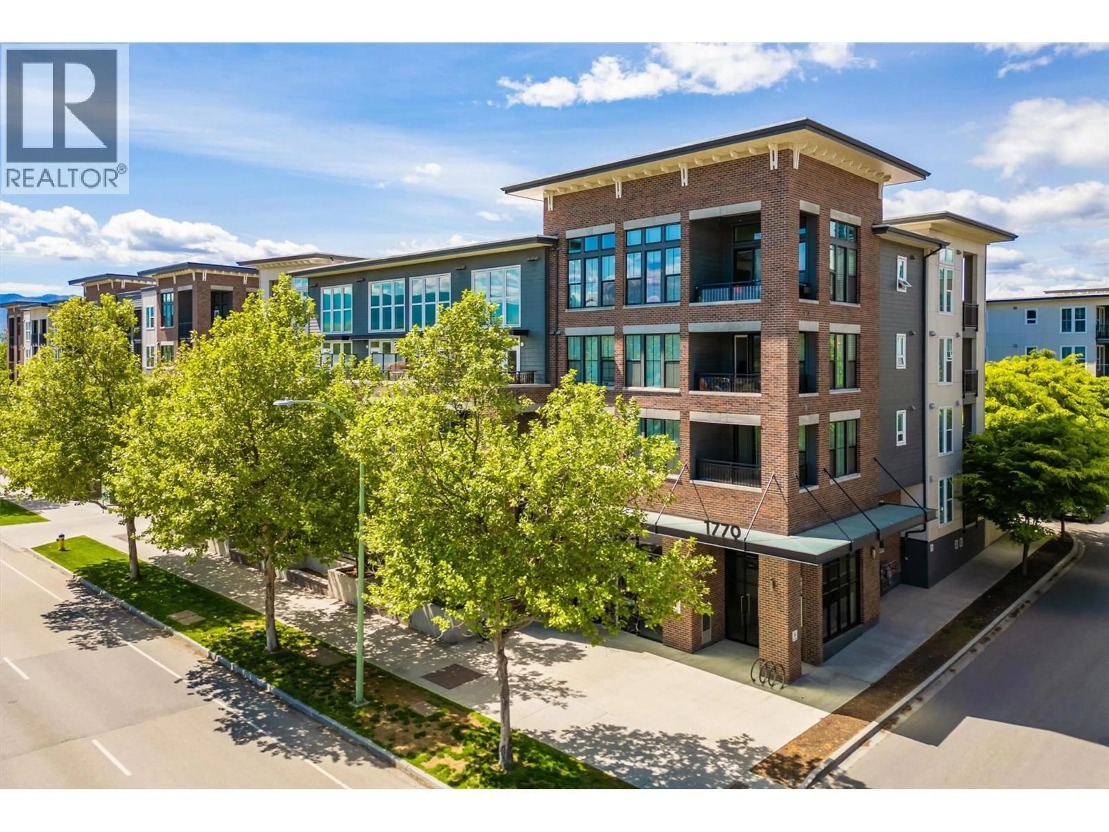 A pic from outside/outdoor area/front of a property/back of a property/a pic from drone, building for 320 - 1770 RICHTER STREET, Kelowna British Columbia V1Y0E6