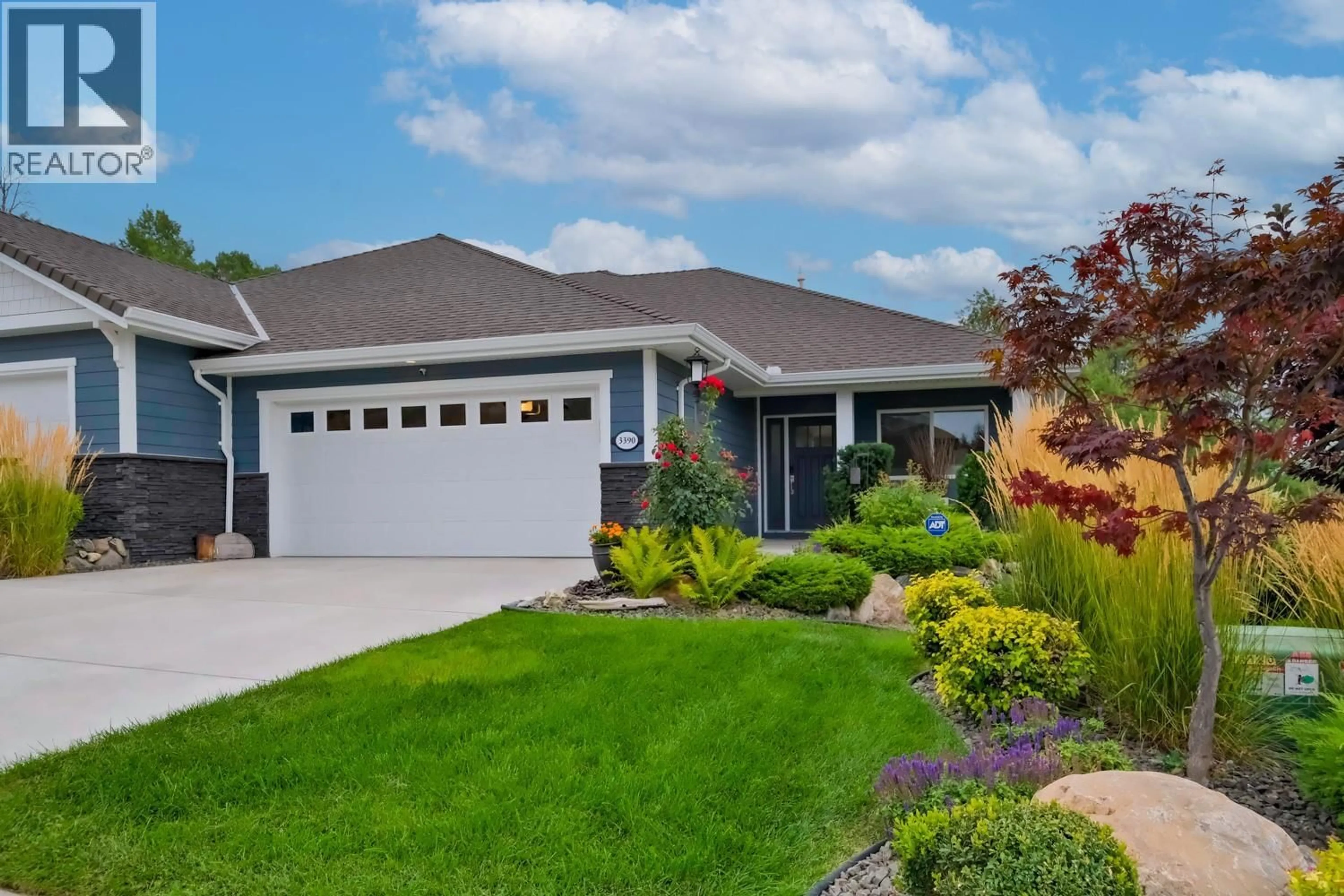 Home with vinyl exterior material, street for 3390 PINE VALLEY DRIVE, Kelowna British Columbia V1X8E3