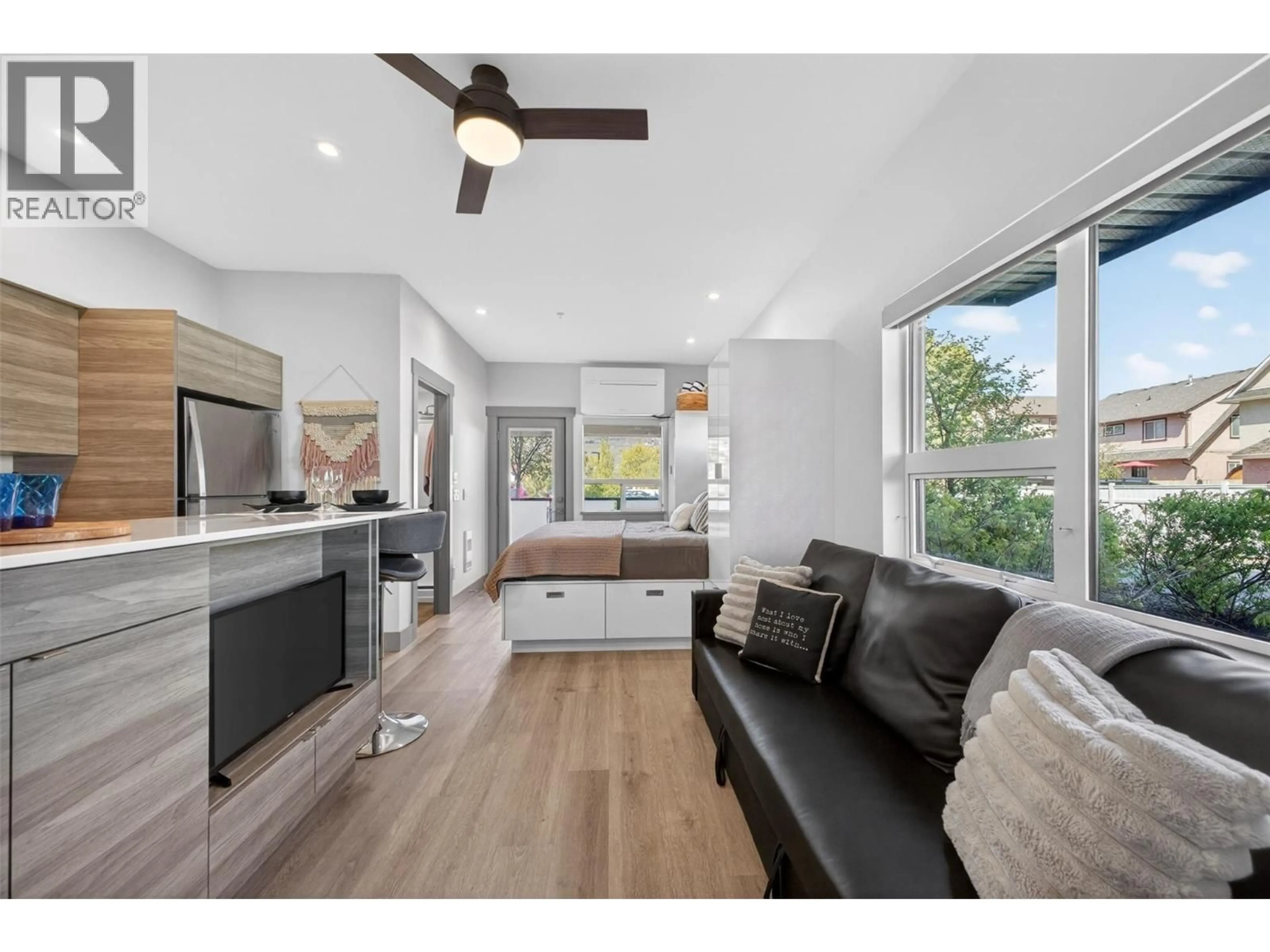 Open concept kitchen, wood/laminate floor for 114 - 2555 LAKESHORE ROAD, Vernon British Columbia V1H0A4