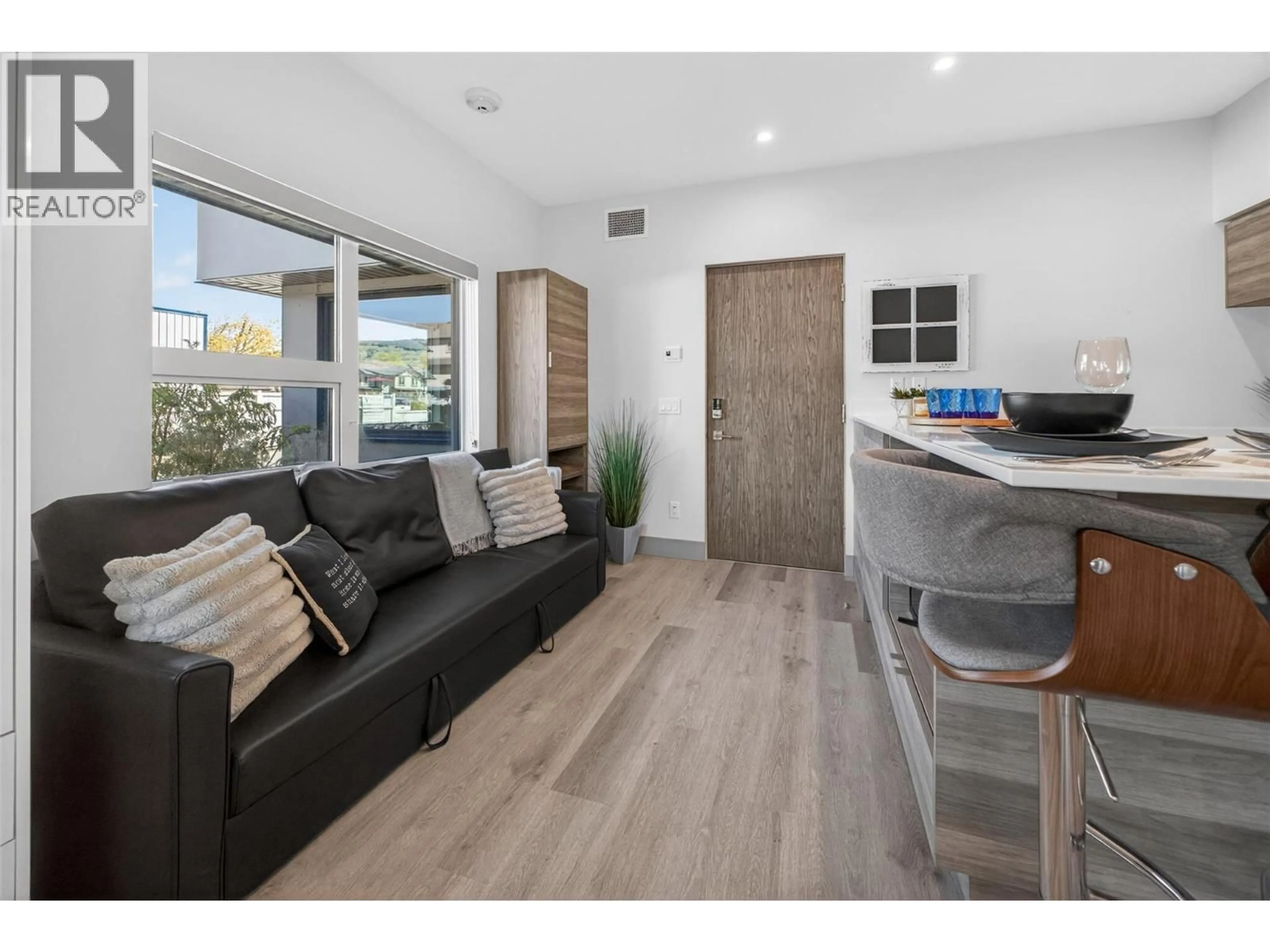 Open concept kitchen, wood/laminate floor for 114 - 2555 LAKESHORE ROAD, Vernon British Columbia V1H0A4