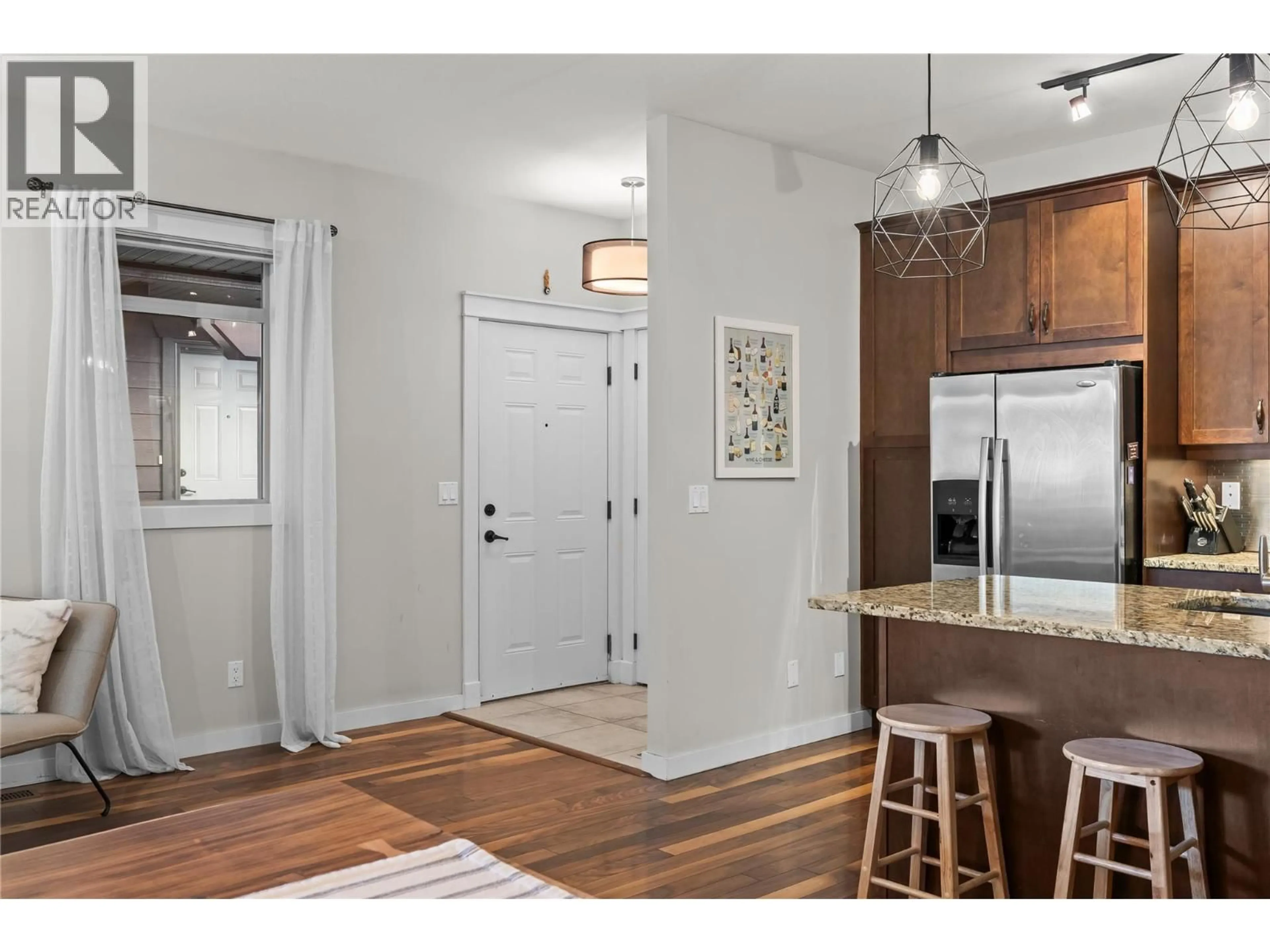 Open concept kitchen, wood/laminate floor for 114 - 511 YATES ROAD, Kelowna British Columbia V1V2X2