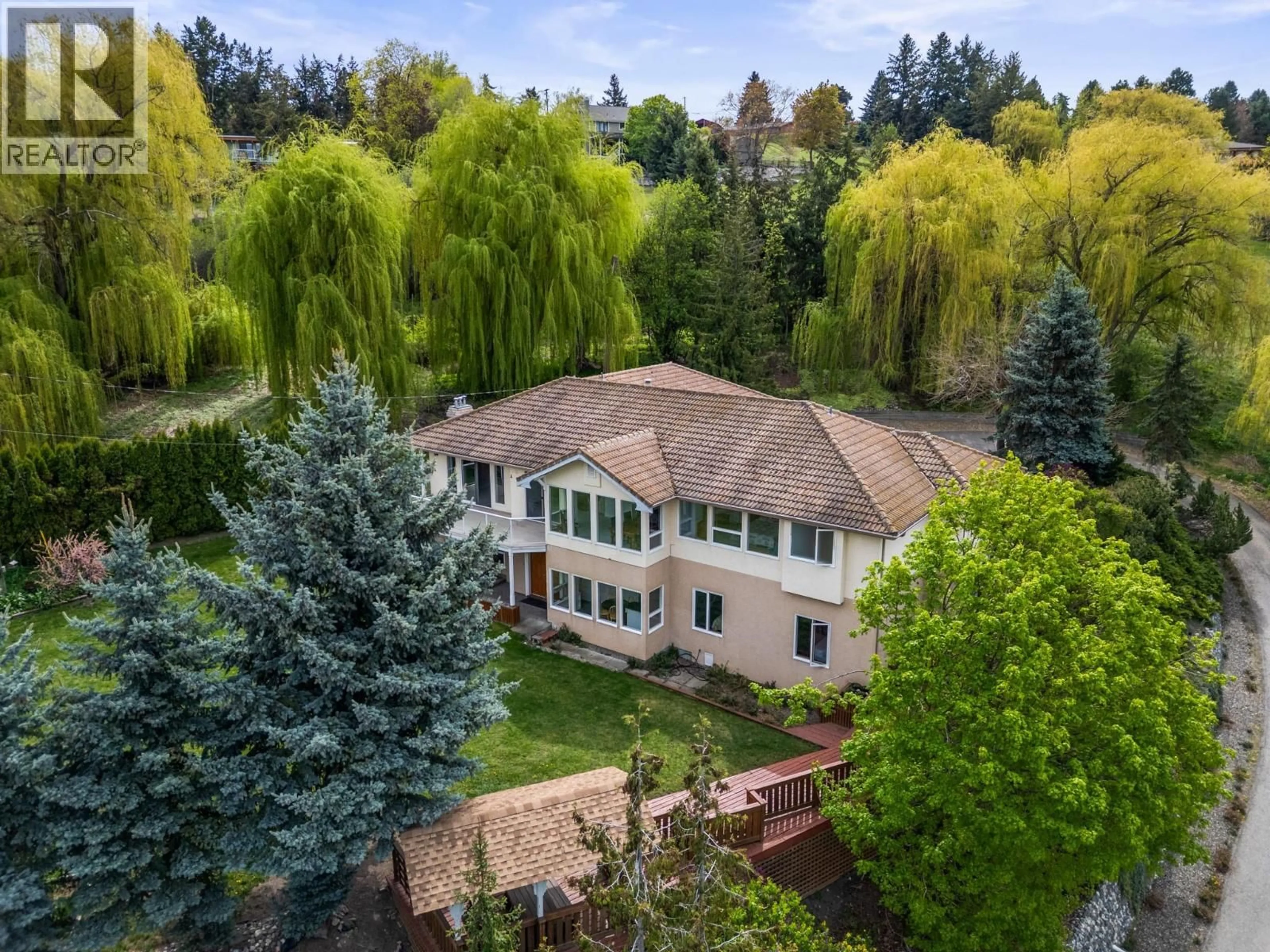 A pic from outside/outdoor area/front of a property/back of a property/a pic from drone, forest/trees view for 363 NORTHWIND DRIVE, Vernon British Columbia V1H1X1